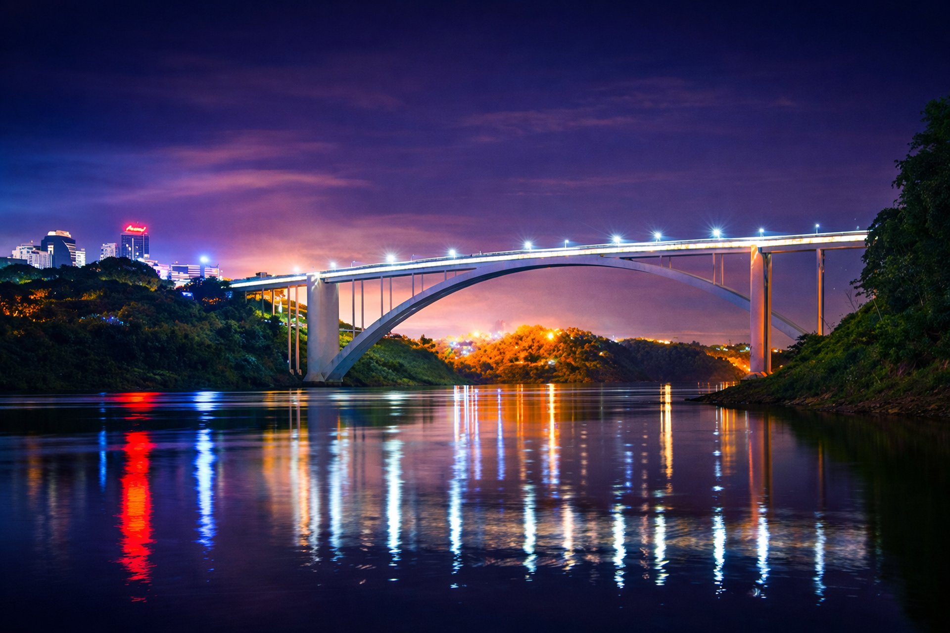 an abstract photo of a curved building with a blue sky in the background