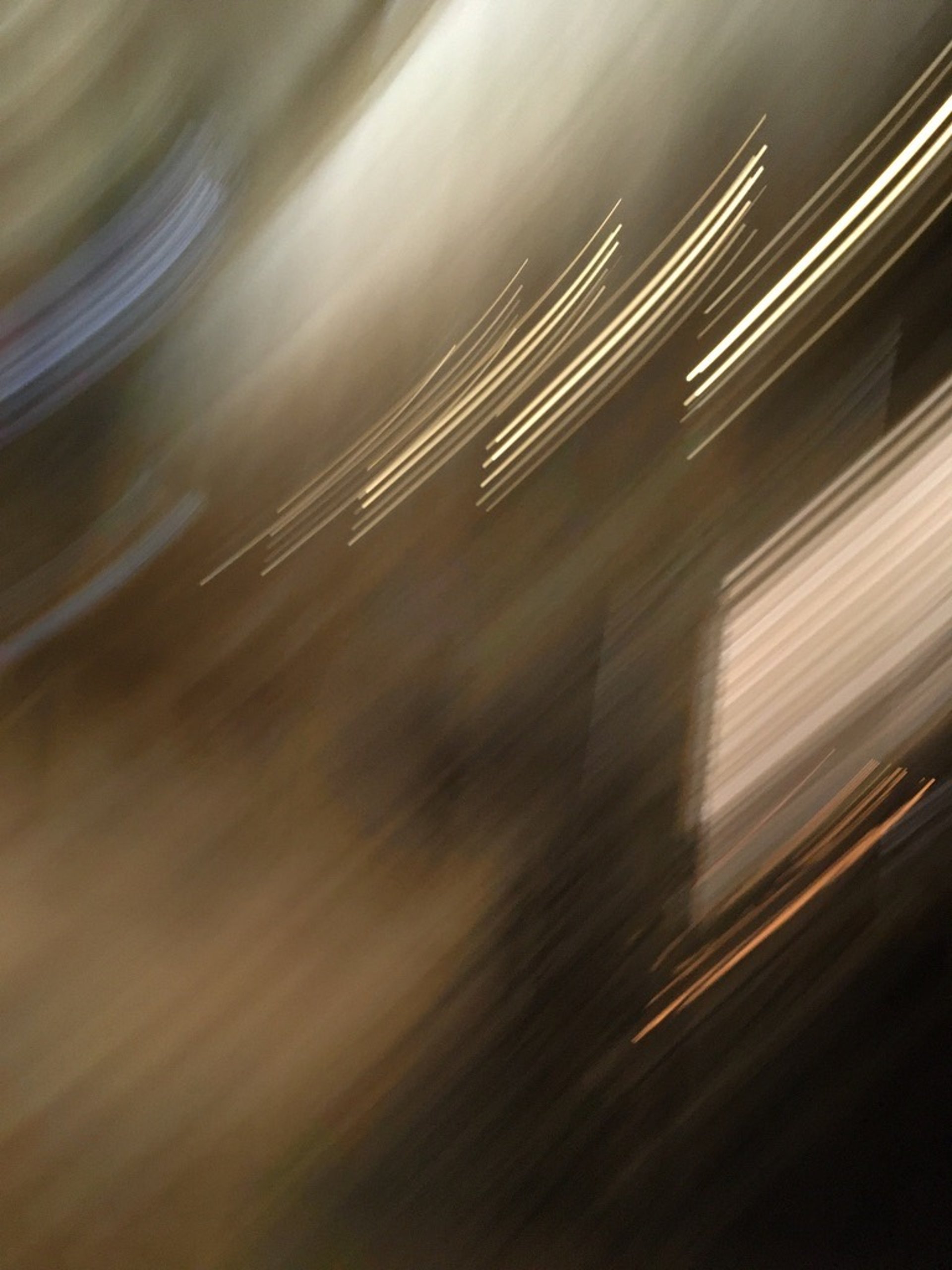 a close up of a shiny surface with a blue sky in the background
