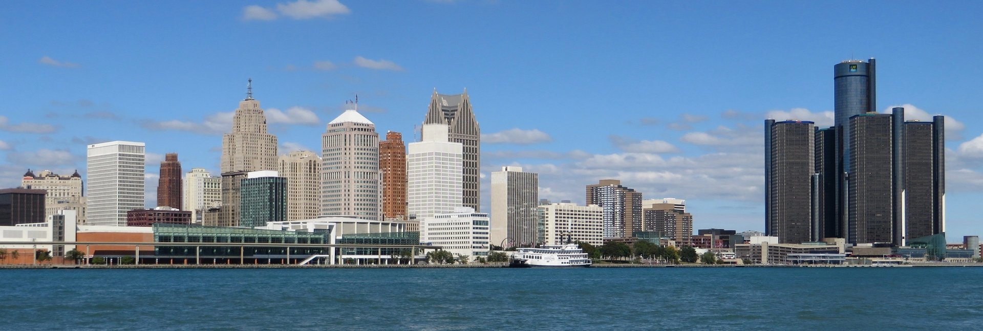 person wearing suit reading business newspaper