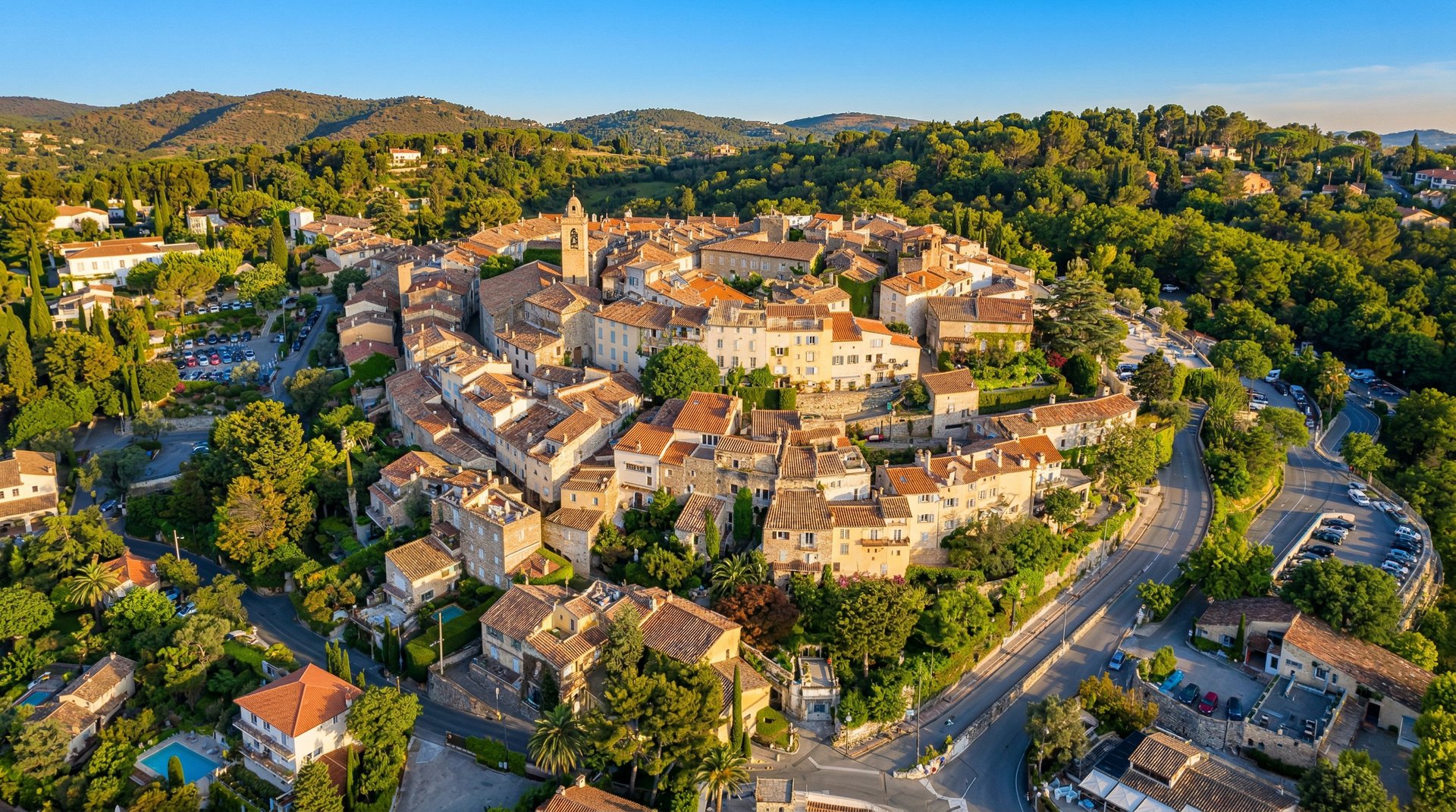 an aerial view of a city next to the ocean