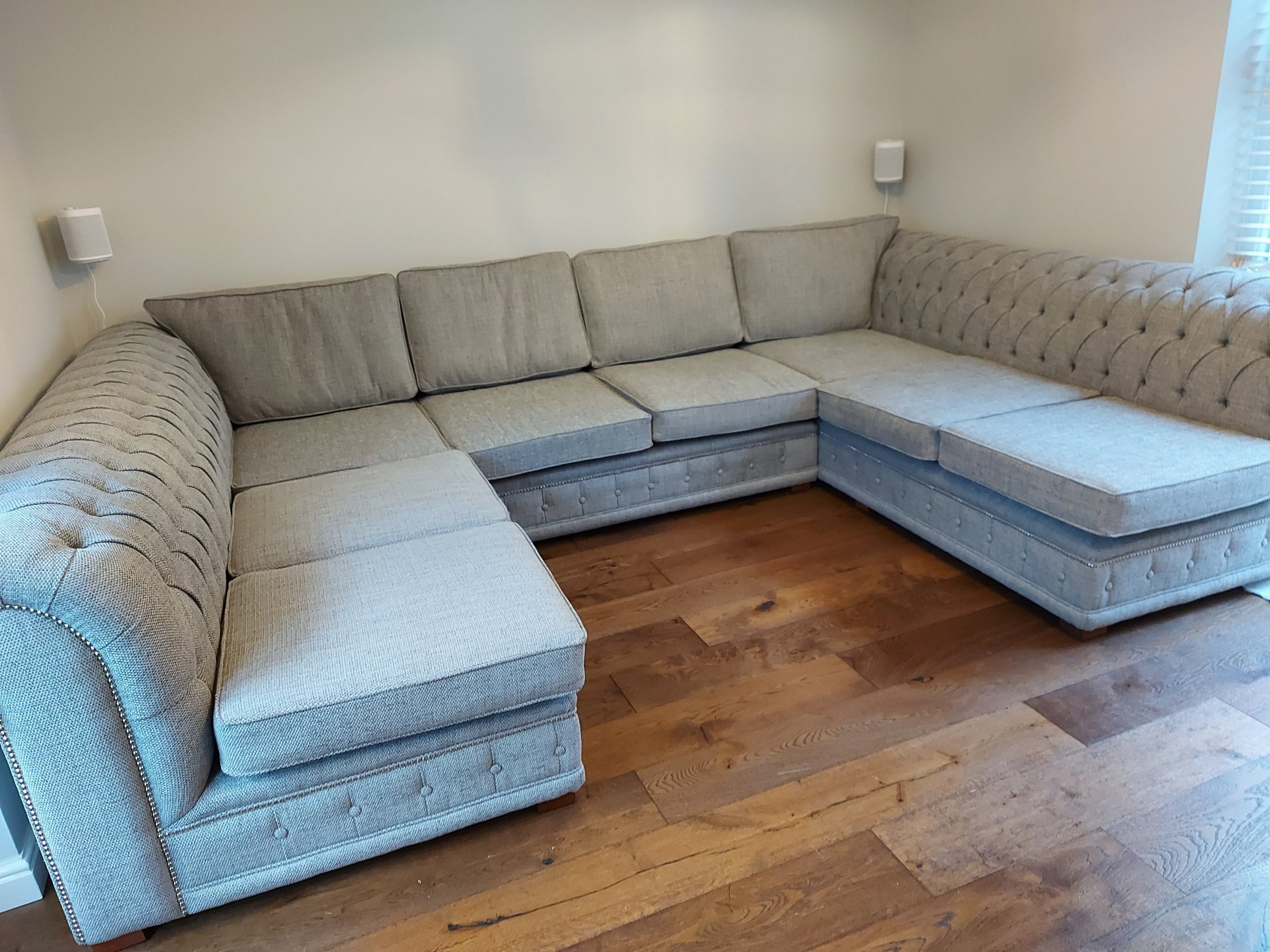 black and brown leather padded tub sofa