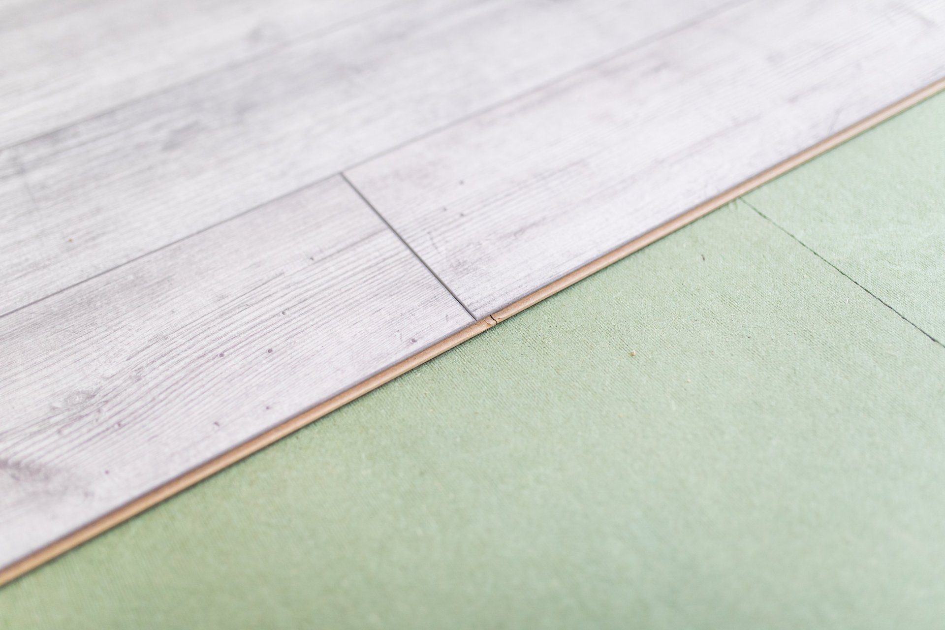 person holding white tile