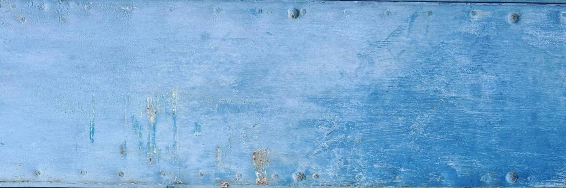 a close up of a wall with some paint on it