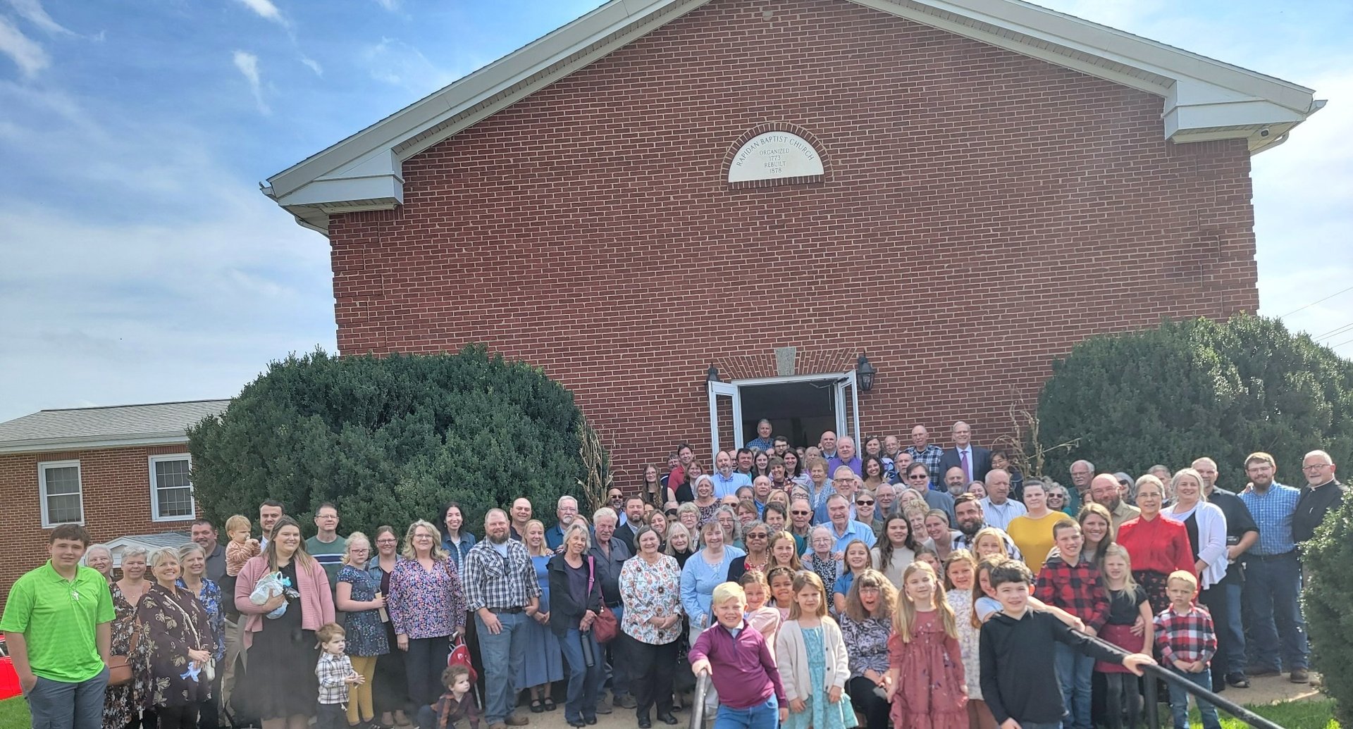 an abstract photo of a curved building with a blue sky in the background
