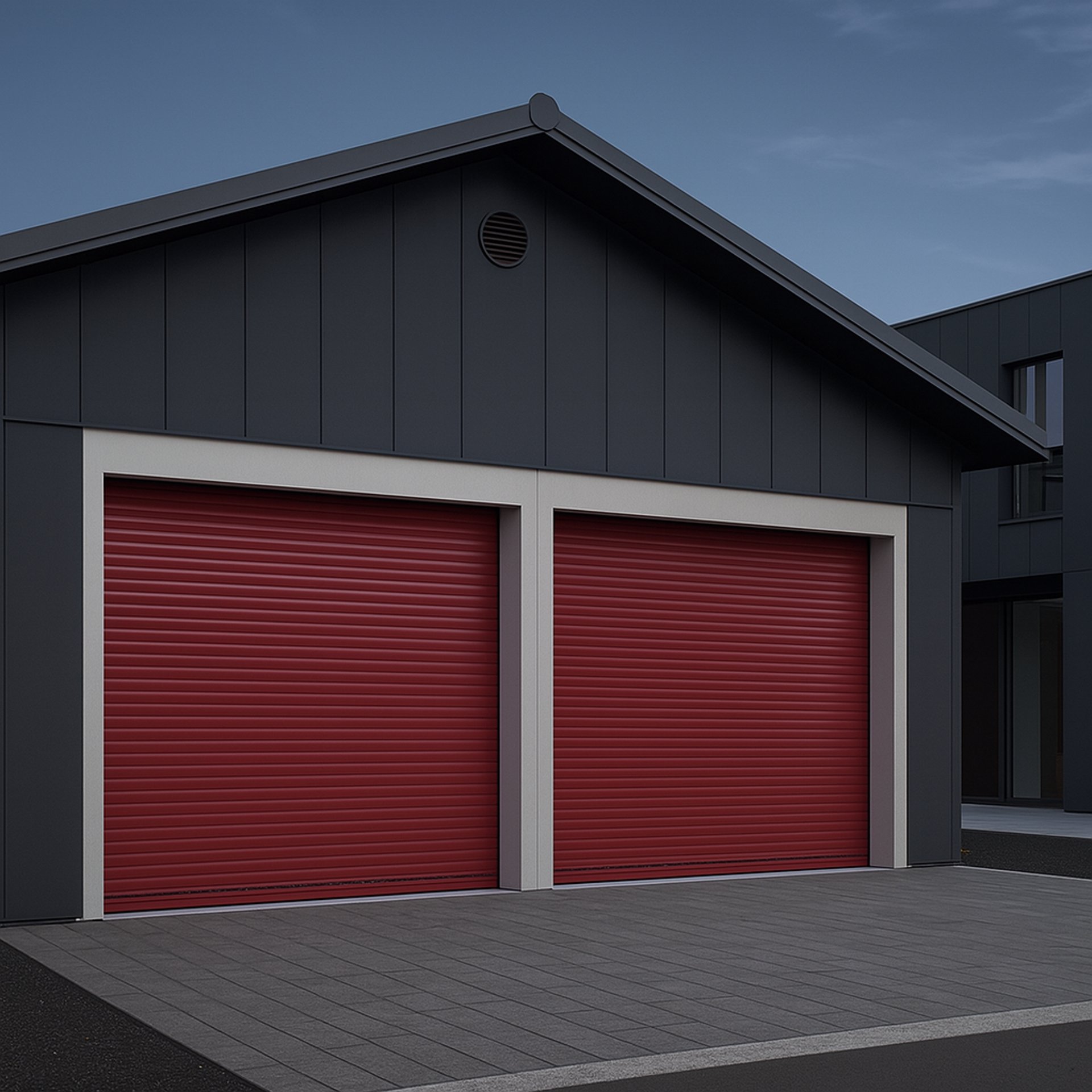 Deux portes de garage enroulables rouges installées sur une maison contemporaine Isovergne