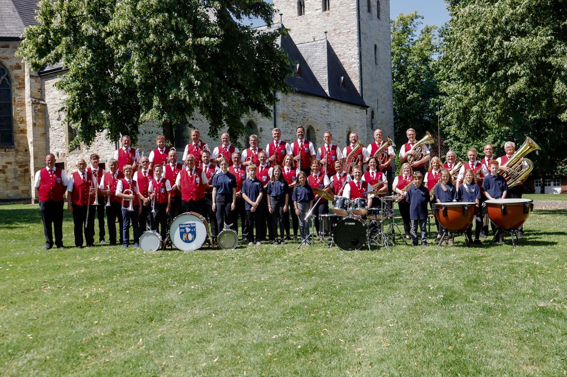 woman wearing yellow long-sleeved dress under white clouds and blue sky during daytime