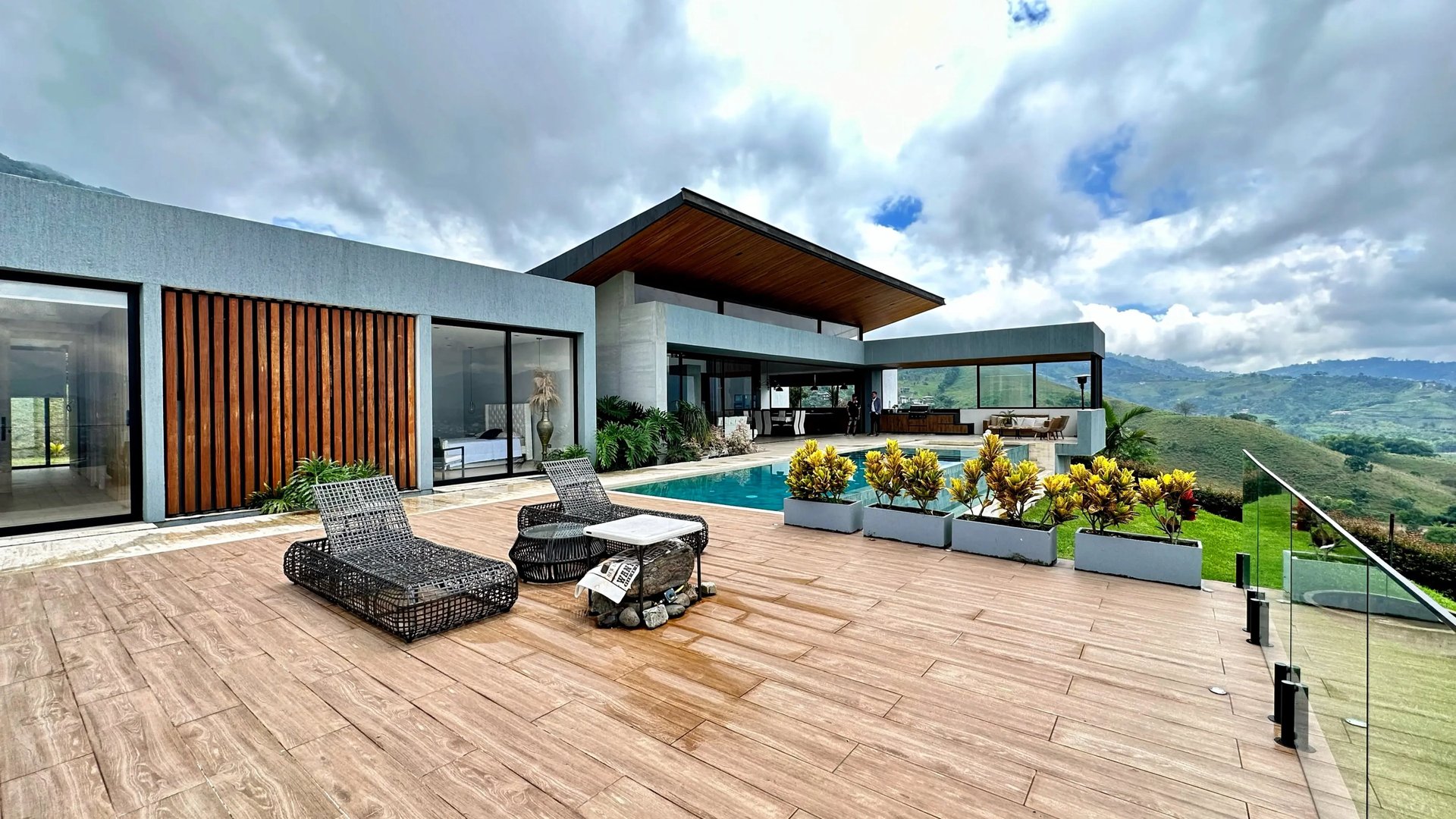 white sofa near brown wooden chair