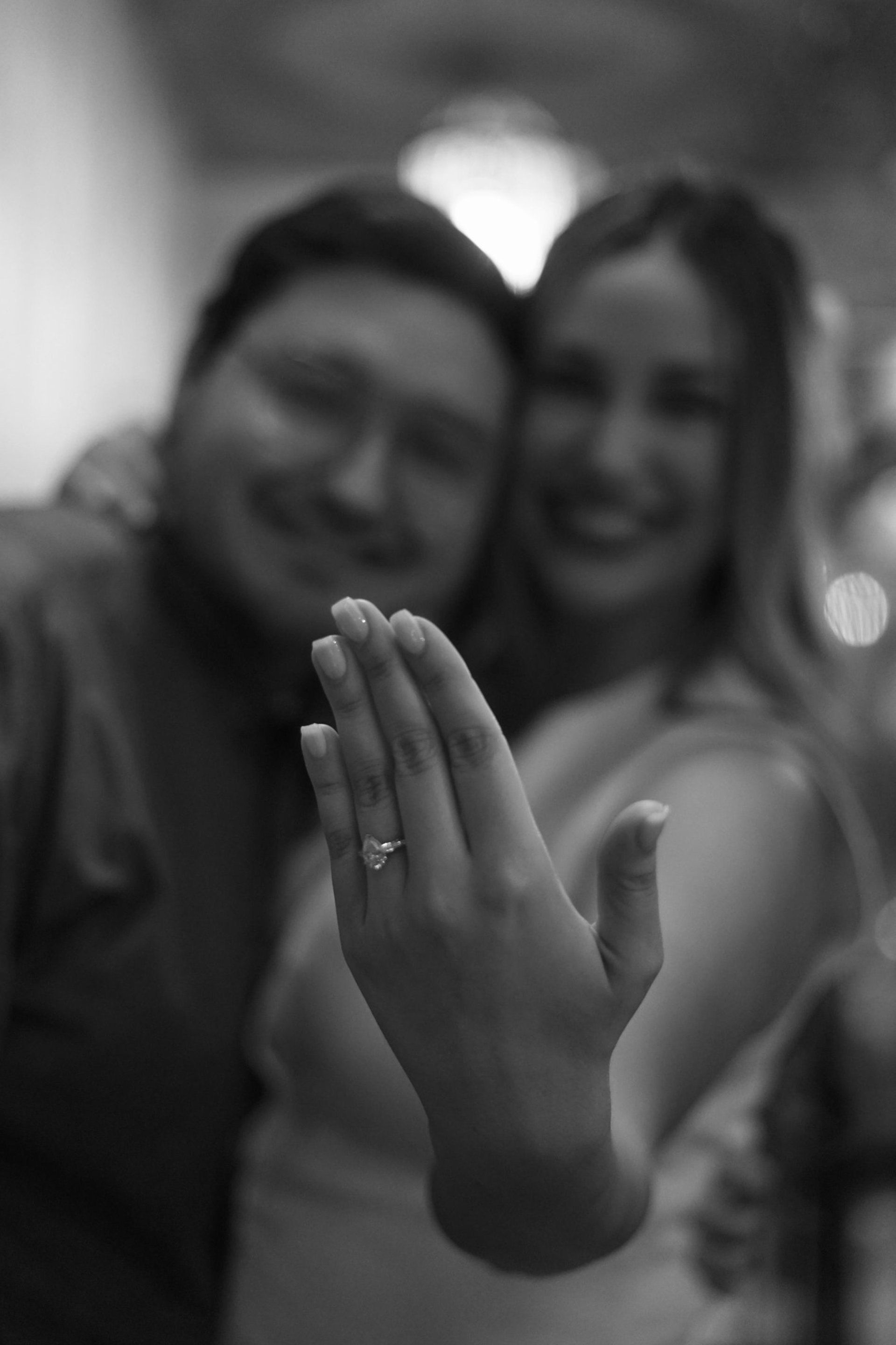 couple wearing silver-colored rings