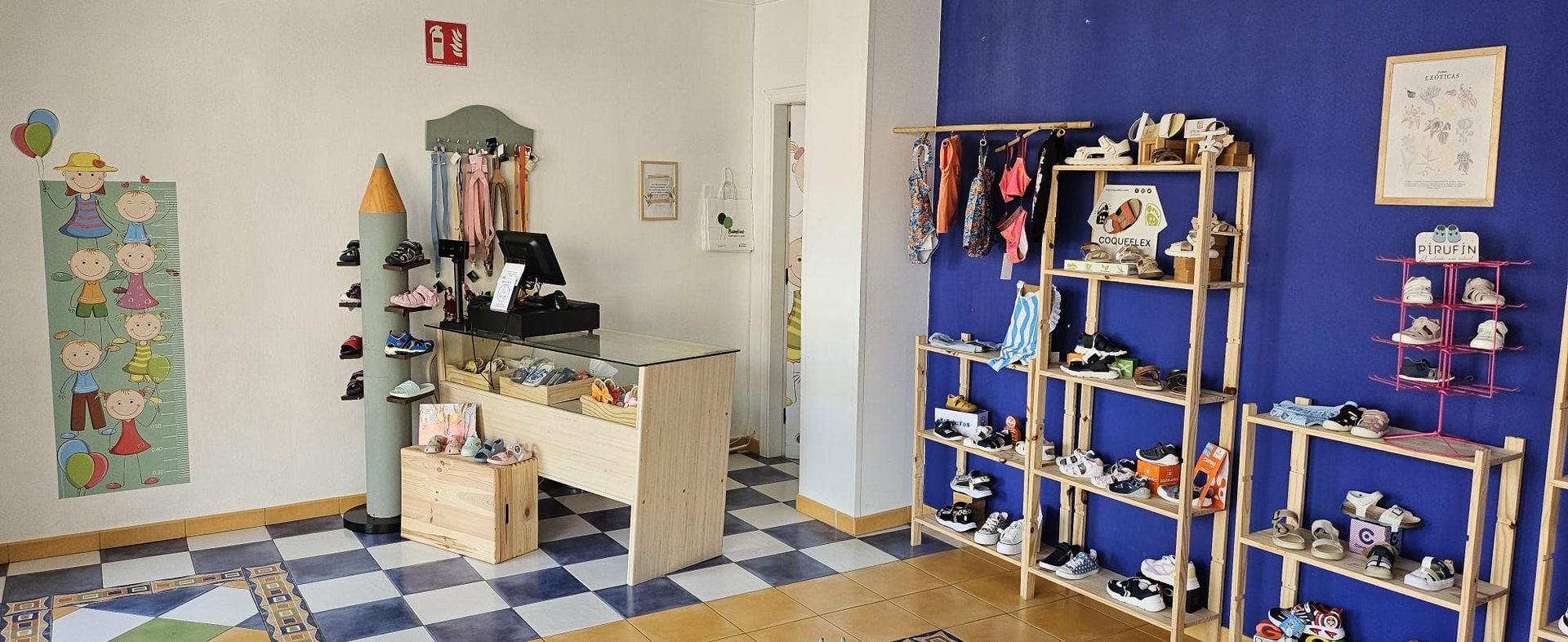 person in blue skirt and white sneakers standing on green grass field during daytime
