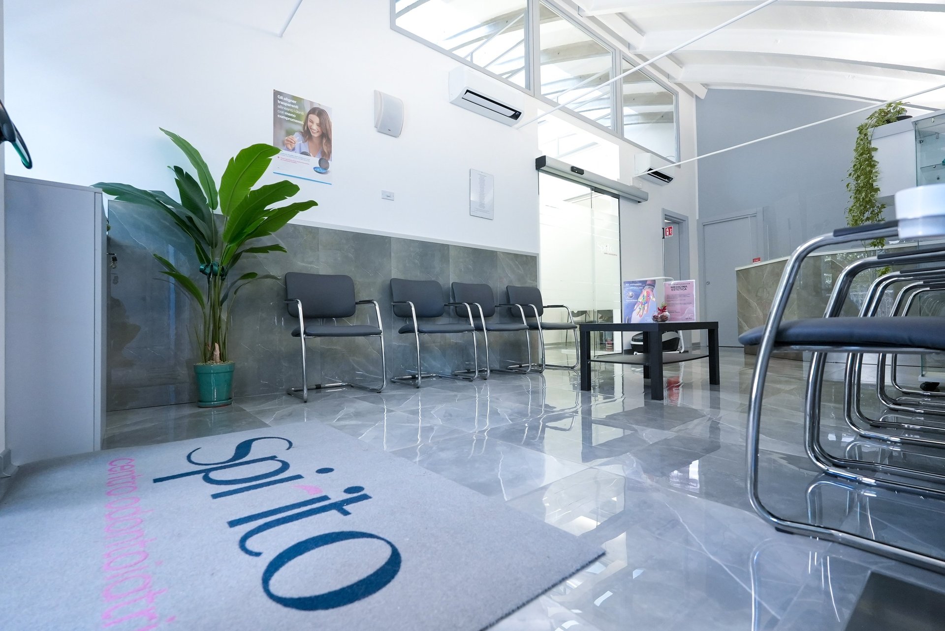 an abstract photo of a curved building with a blue sky in the background