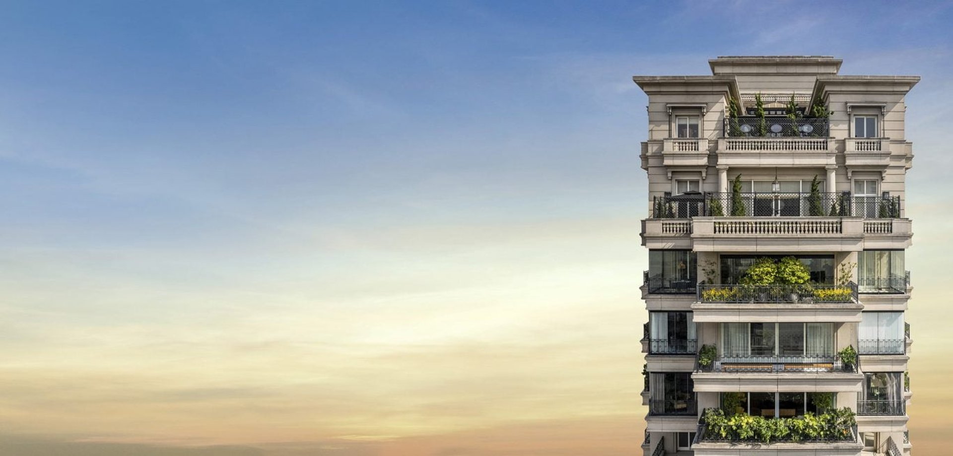 a woman sitting at a table writing on a piece of paper