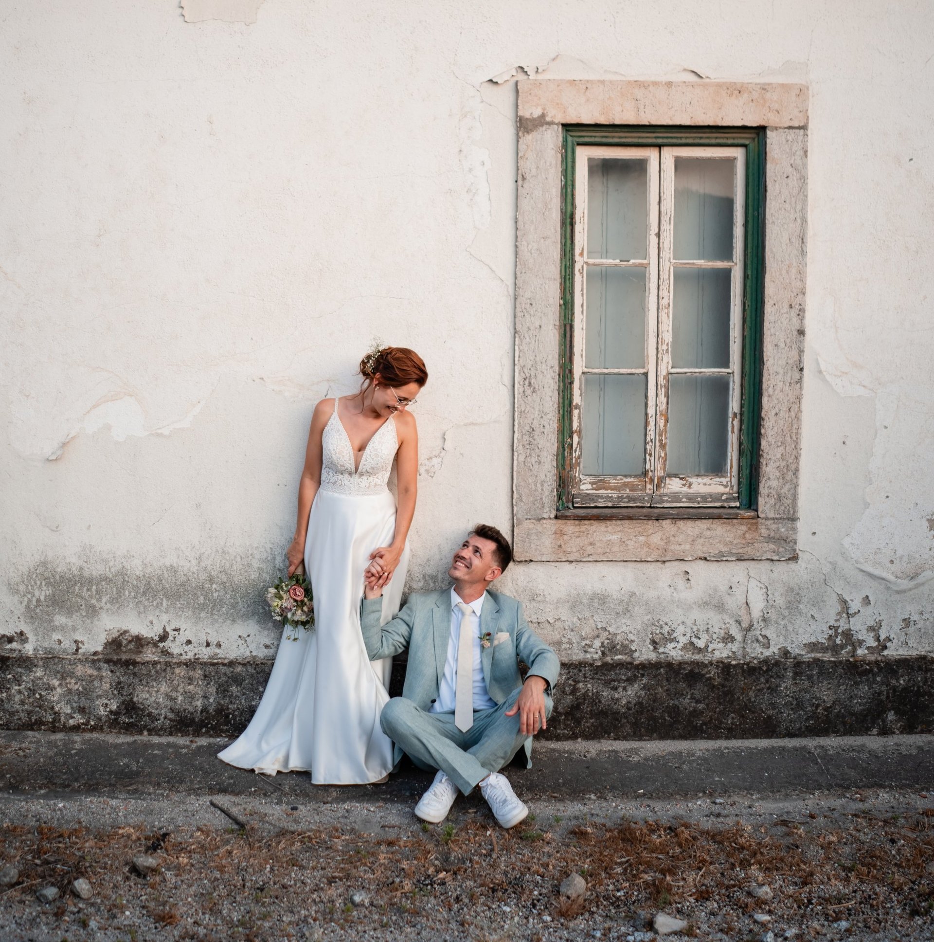 two people standing on brown wooden floor