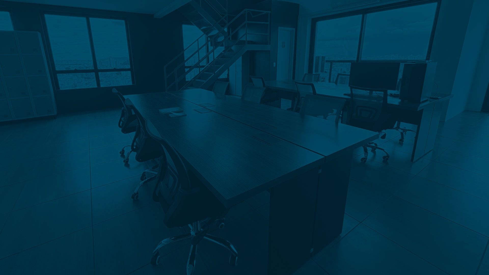 an abstract photo of a curved building with a blue sky in the background