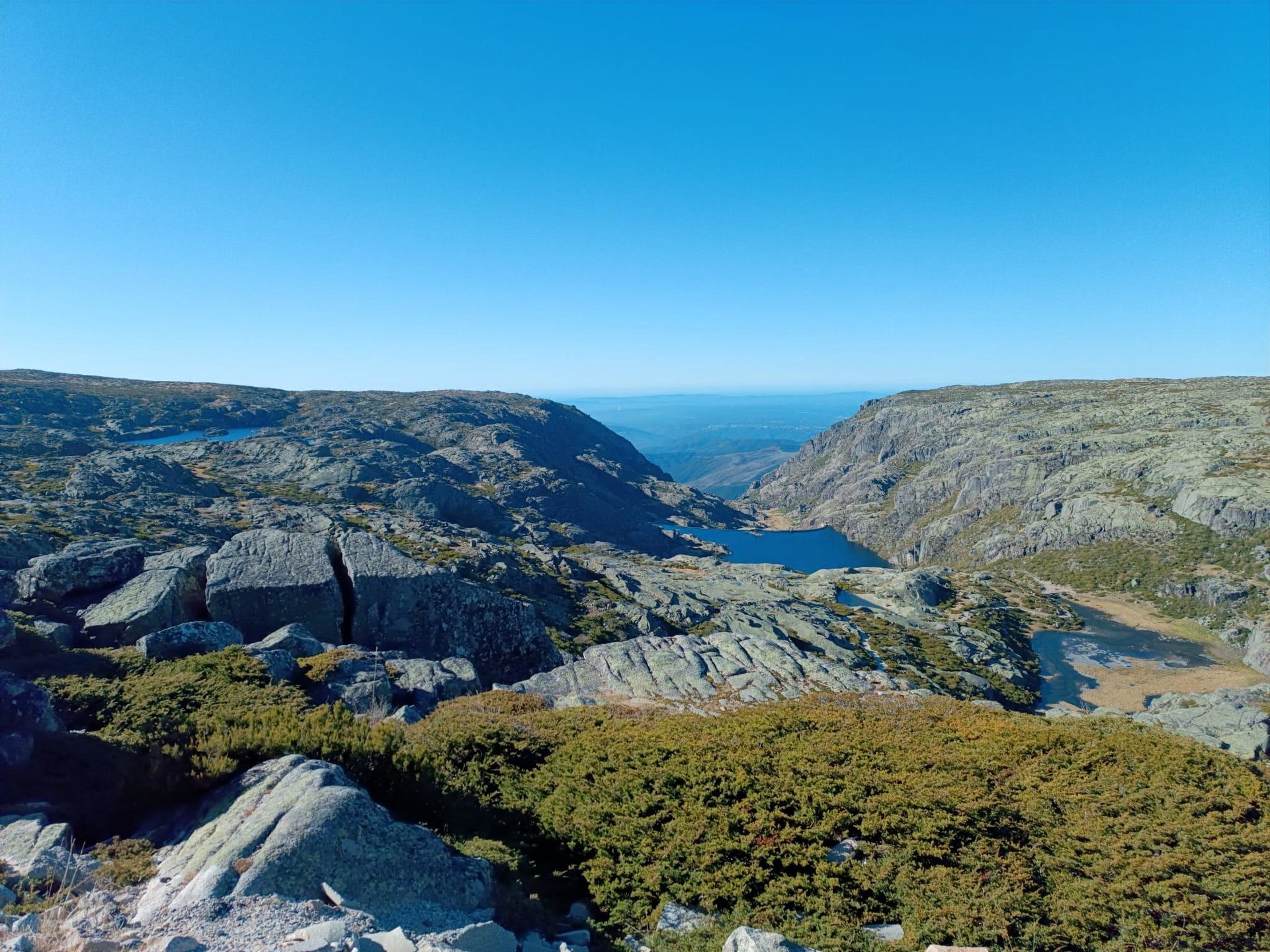 an abstract photo of a curved building with a blue sky in the background