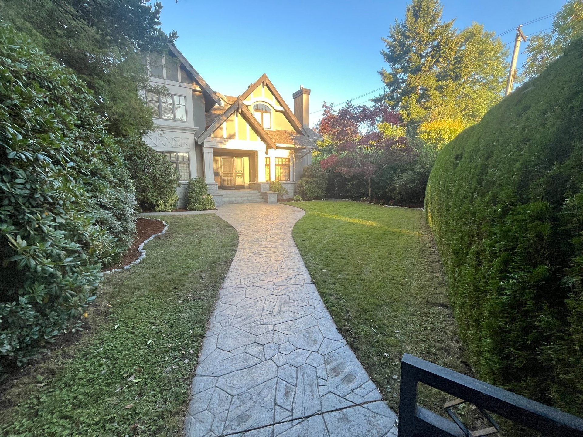 an abstract photo of a curved building with a blue sky in the background