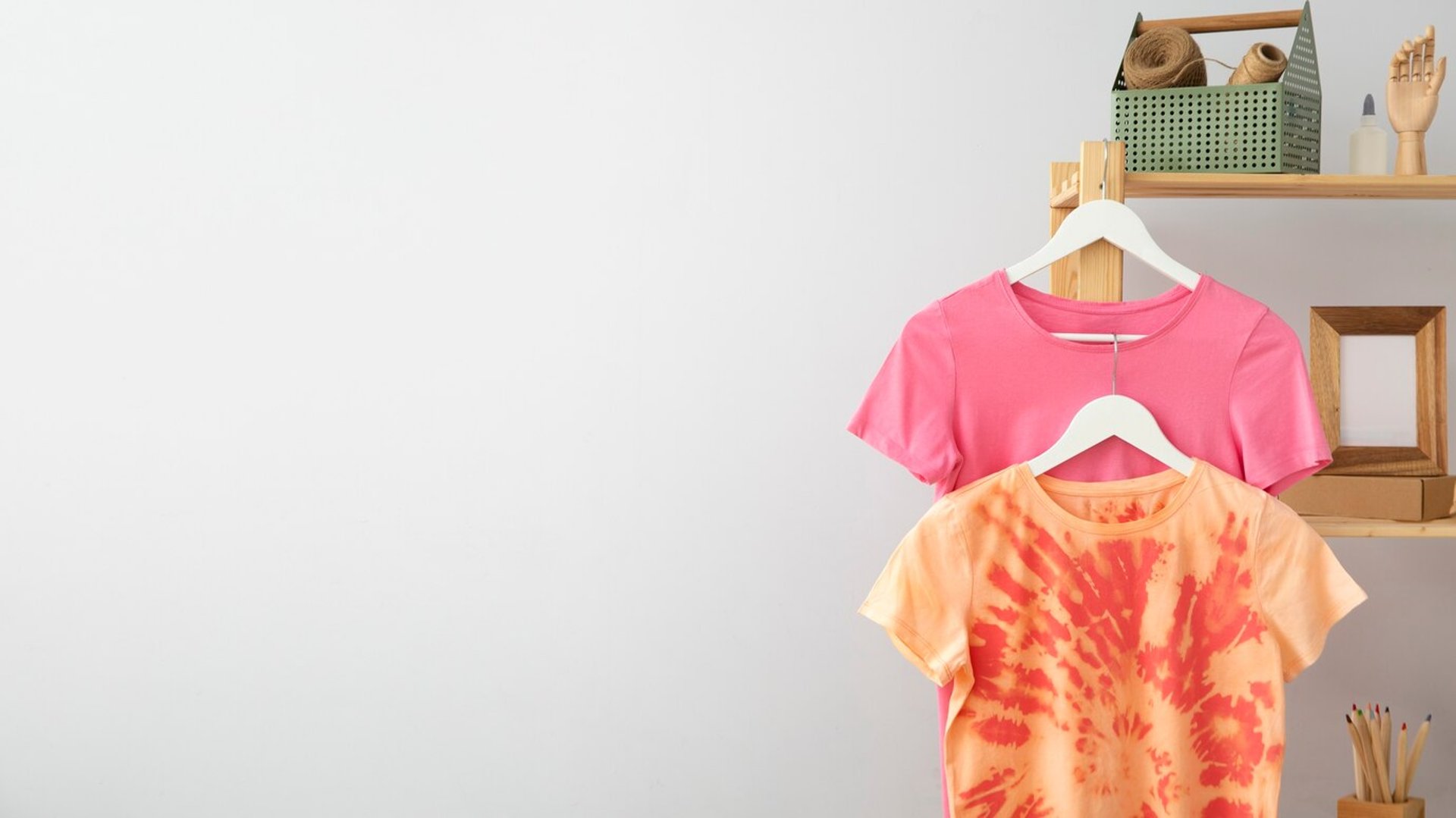 clothes hanging on white rack