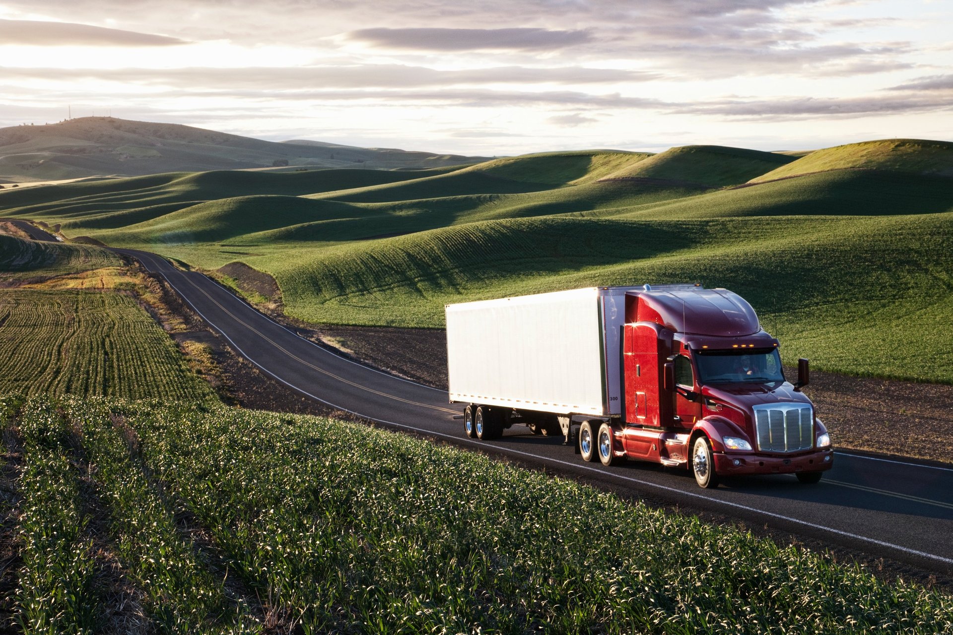 an abstract photo of a curved building with a blue sky in the background