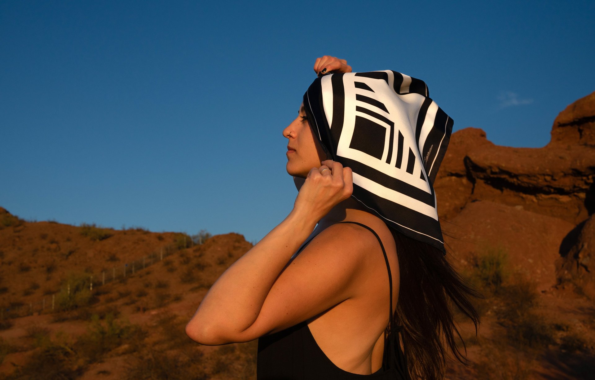 an abstract photo of a curved building with a blue sky in the background