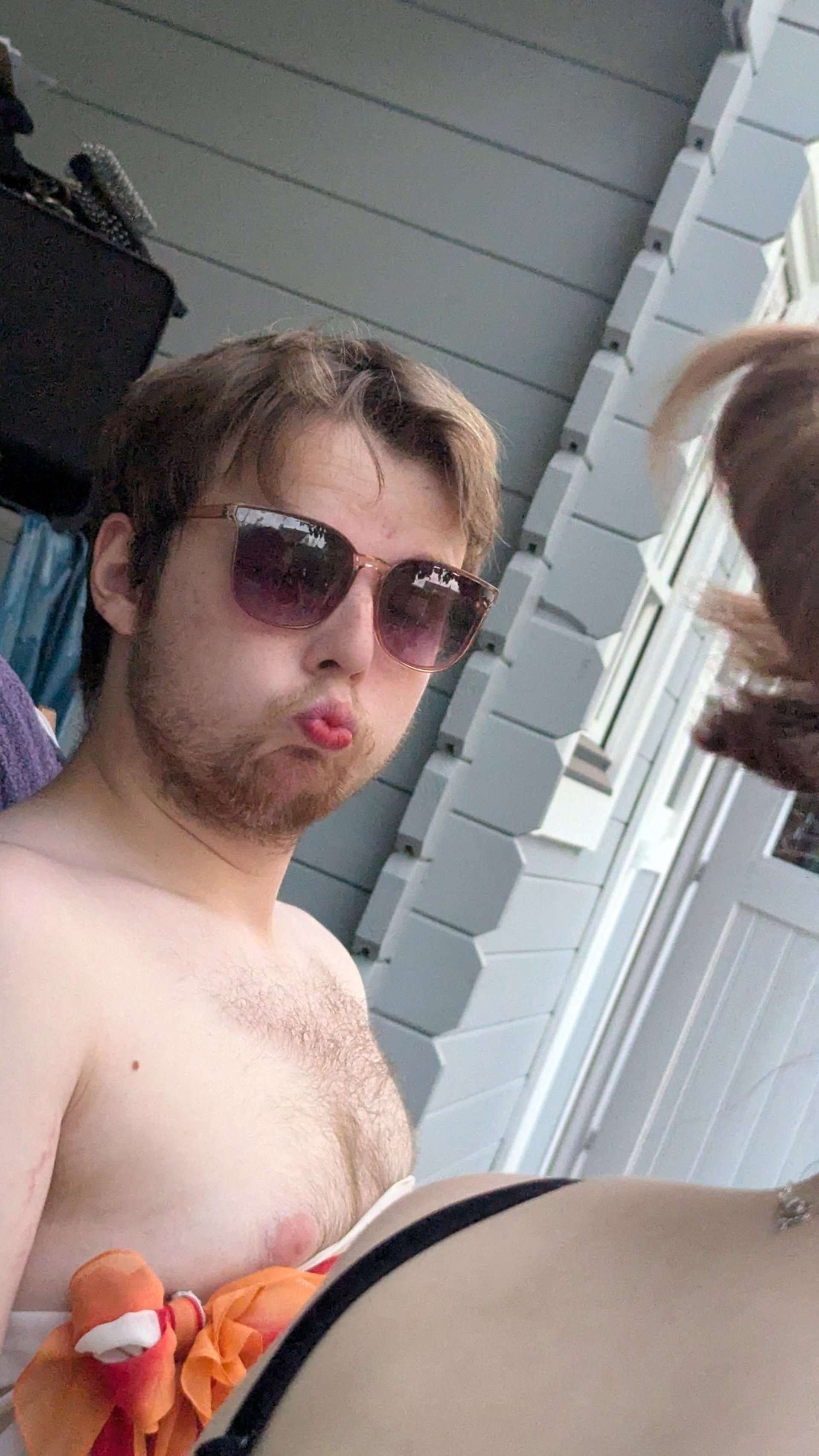 an abstract photo of a curved building with a blue sky in the background