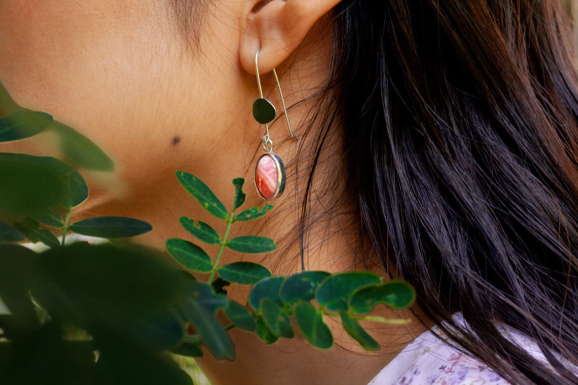 woman holding dried flower