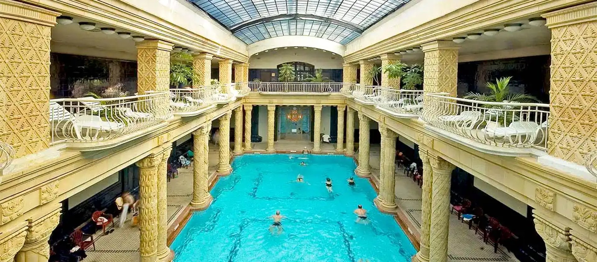 an abstract photo of a curved building with a blue sky in the background