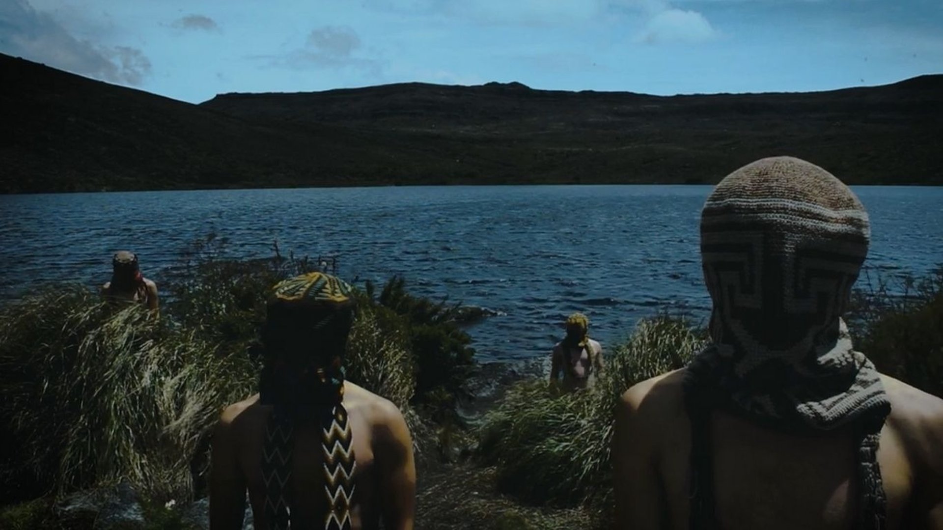 an abstract photo of a curved building with a blue sky in the background