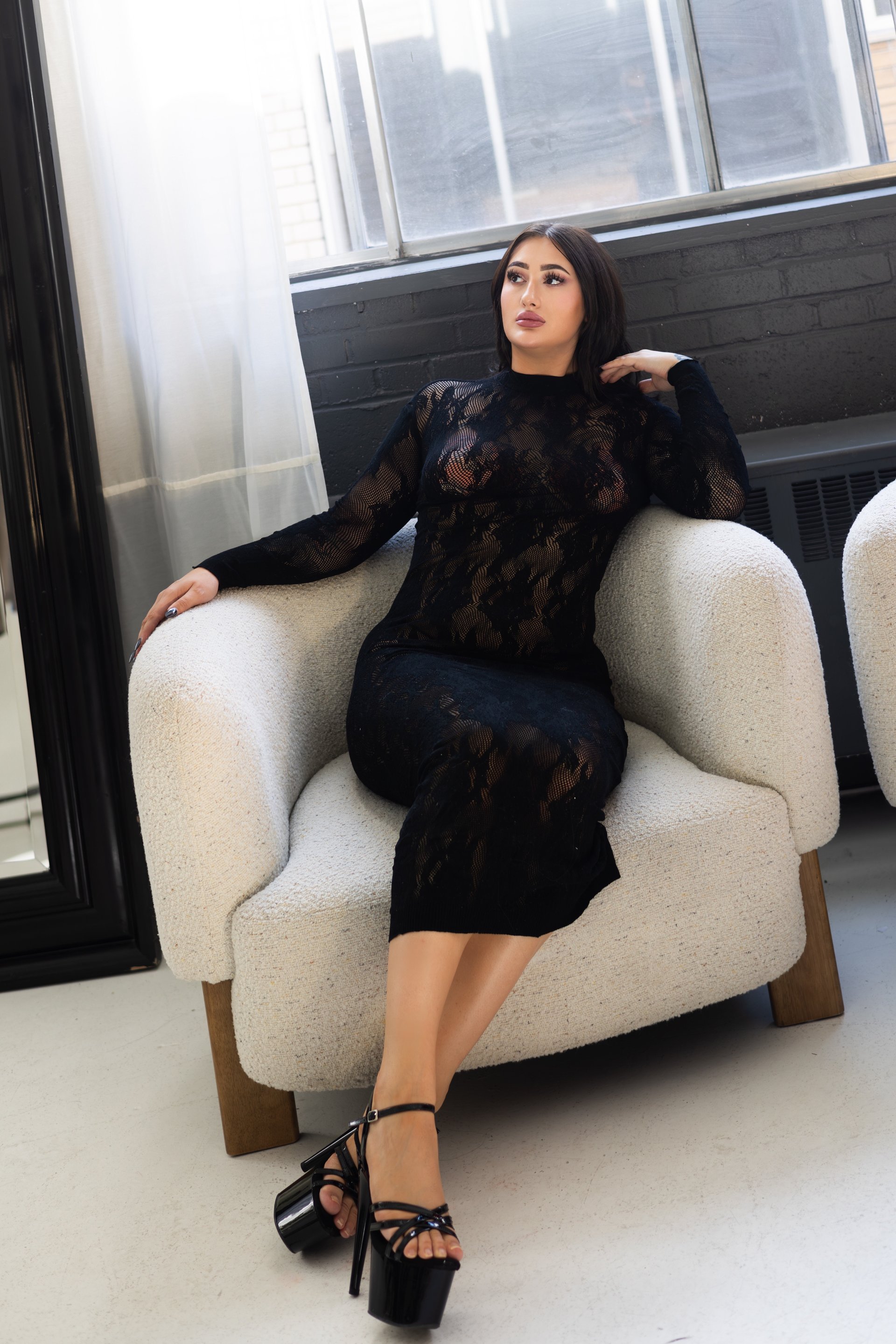 an abstract photo of a curved building with a blue sky in the background