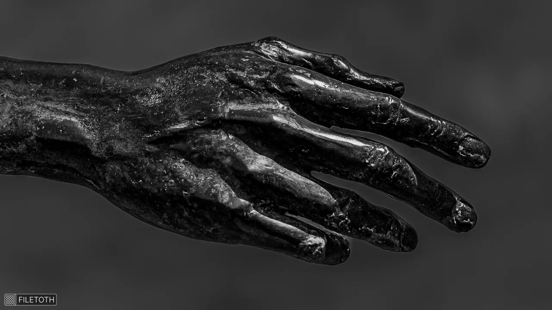 Hand of Imre Soós statue reaching outward gesture of expression and desire.