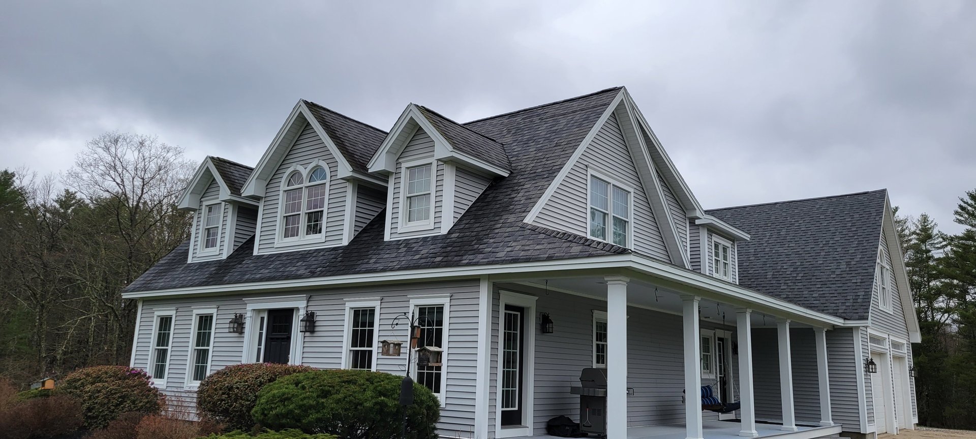 a group of men standing next to each other in front of a building