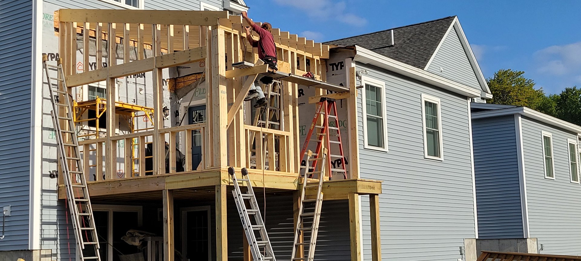 an abstract photo of a curved building with a blue sky in the background