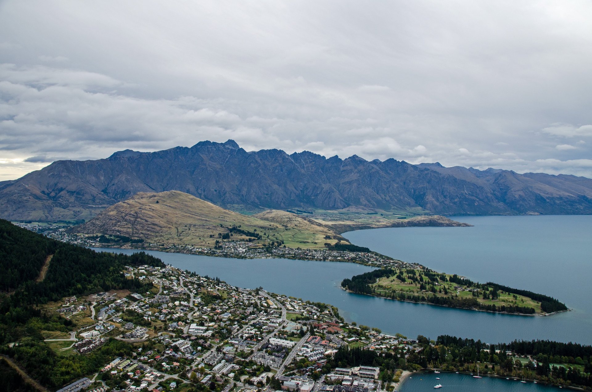 an abstract photo of a curved building with a blue sky in the background