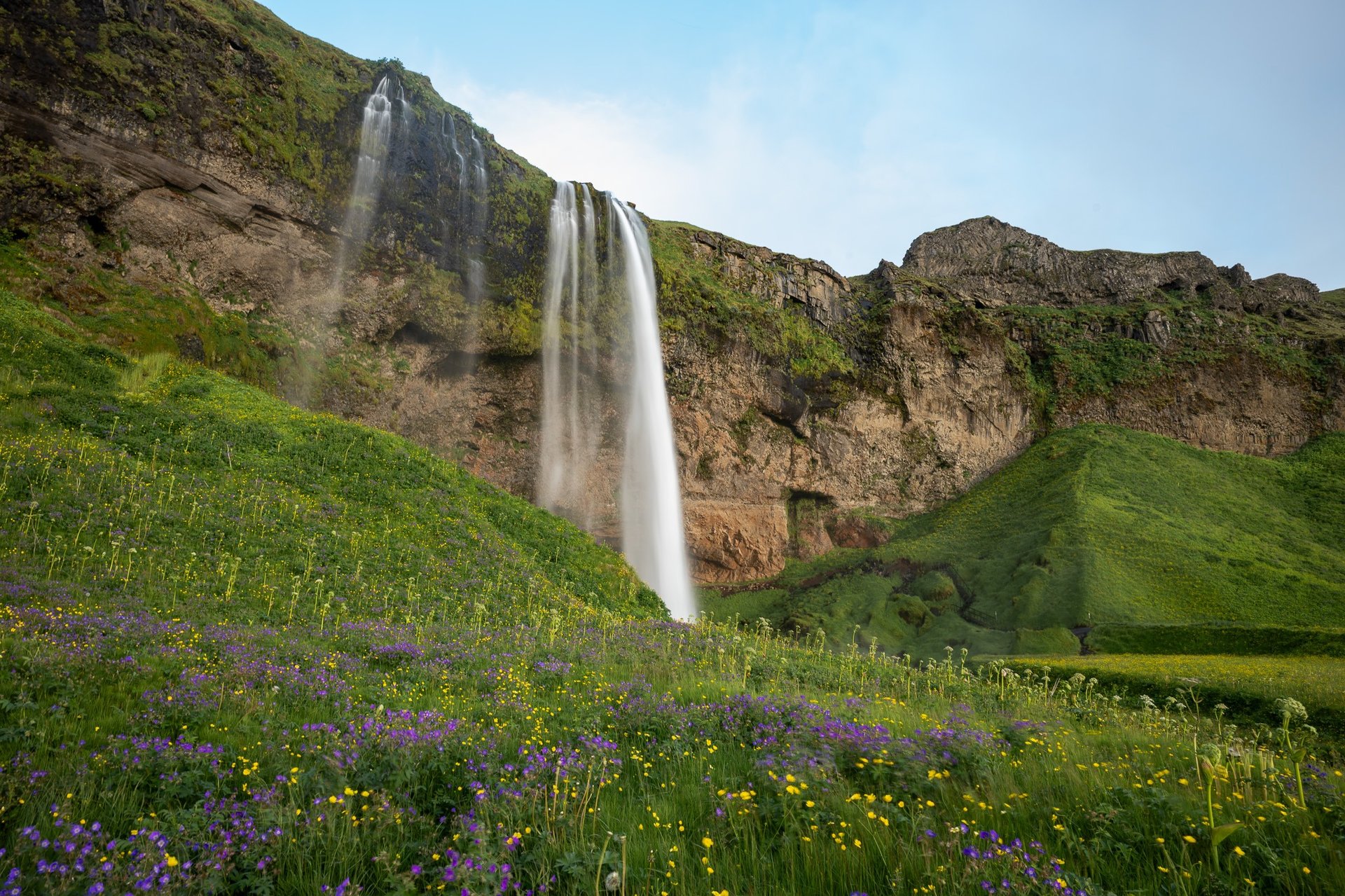 an abstract photo of a curved building with a blue sky in the background