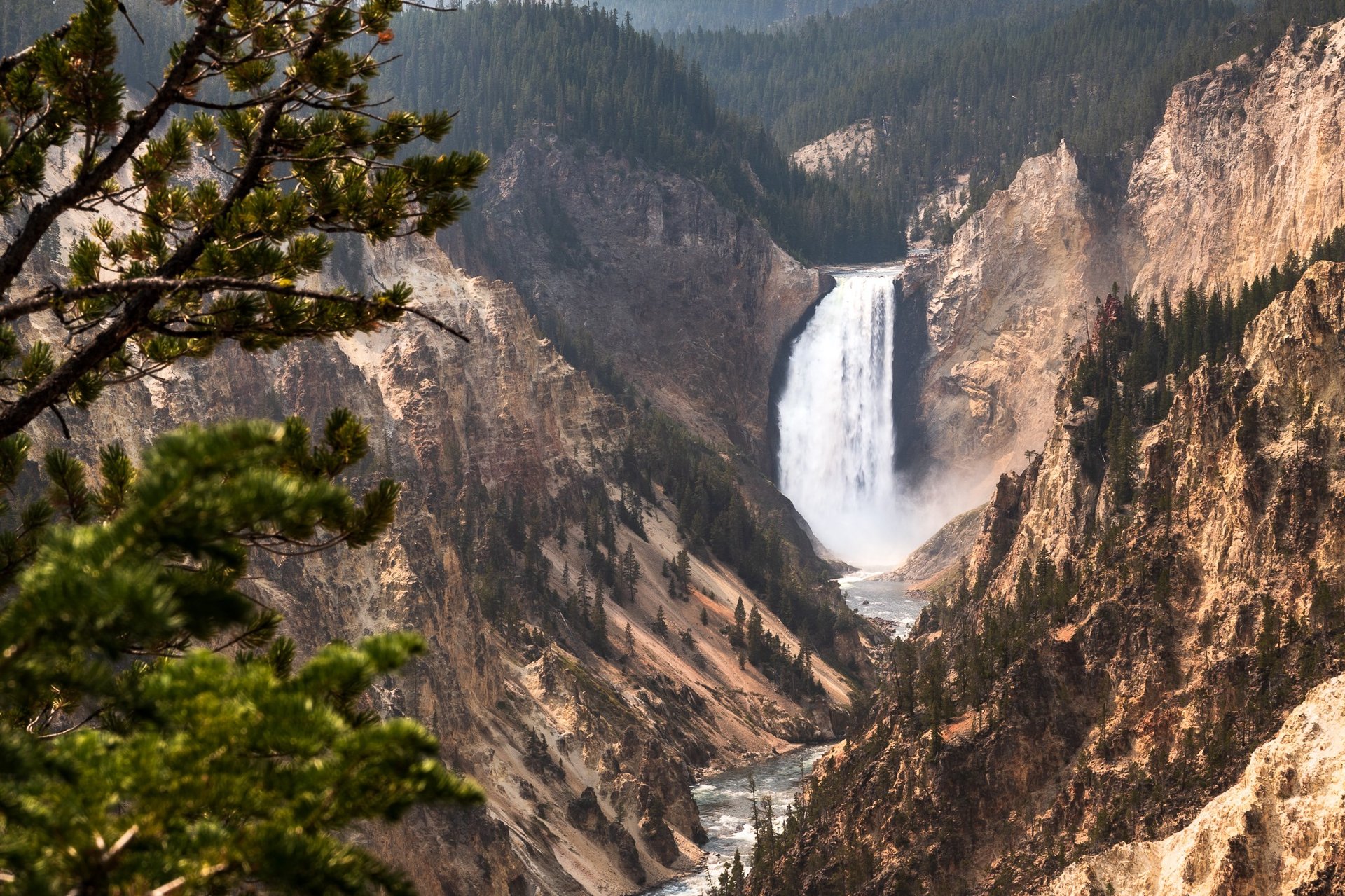 an abstract photo of a curved building with a blue sky in the background