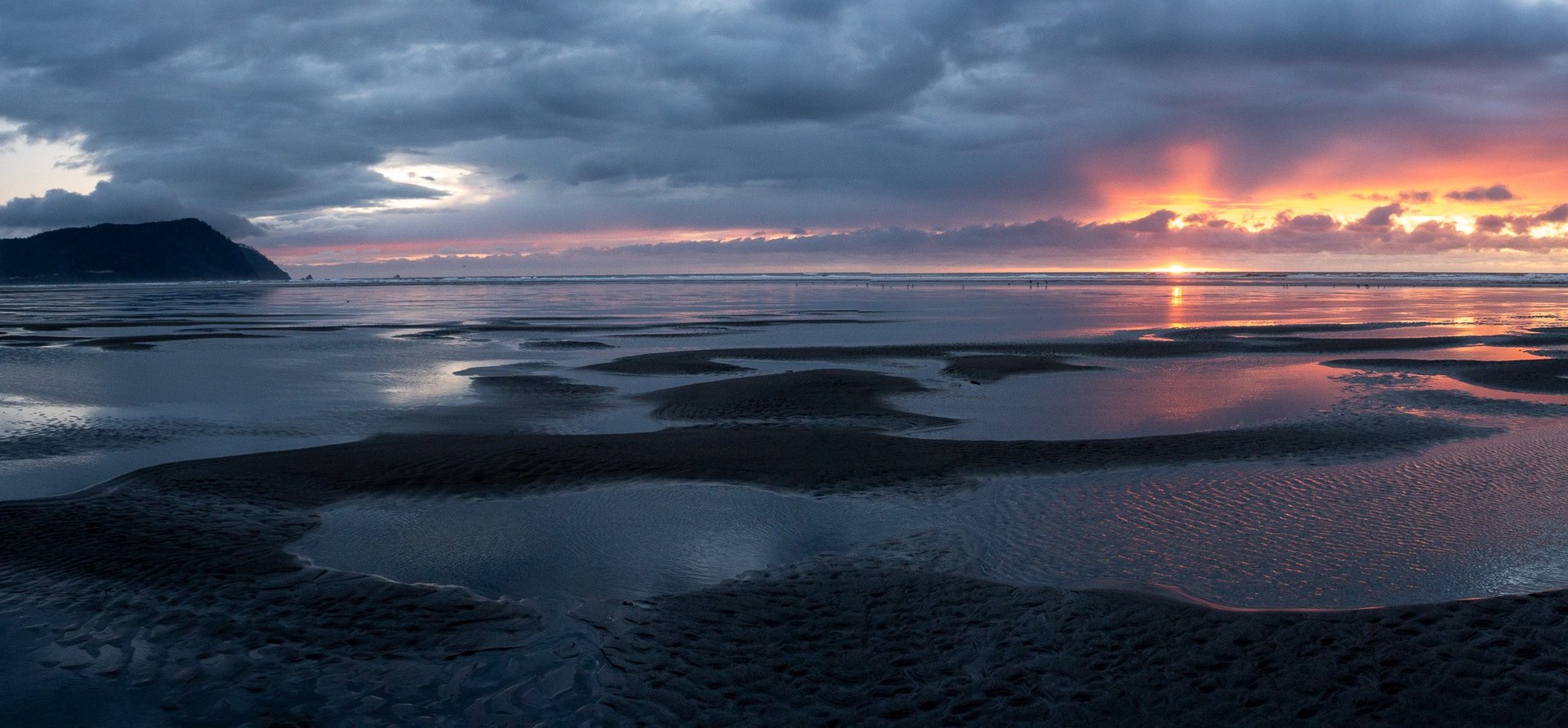 an abstract photo of a curved building with a blue sky in the background