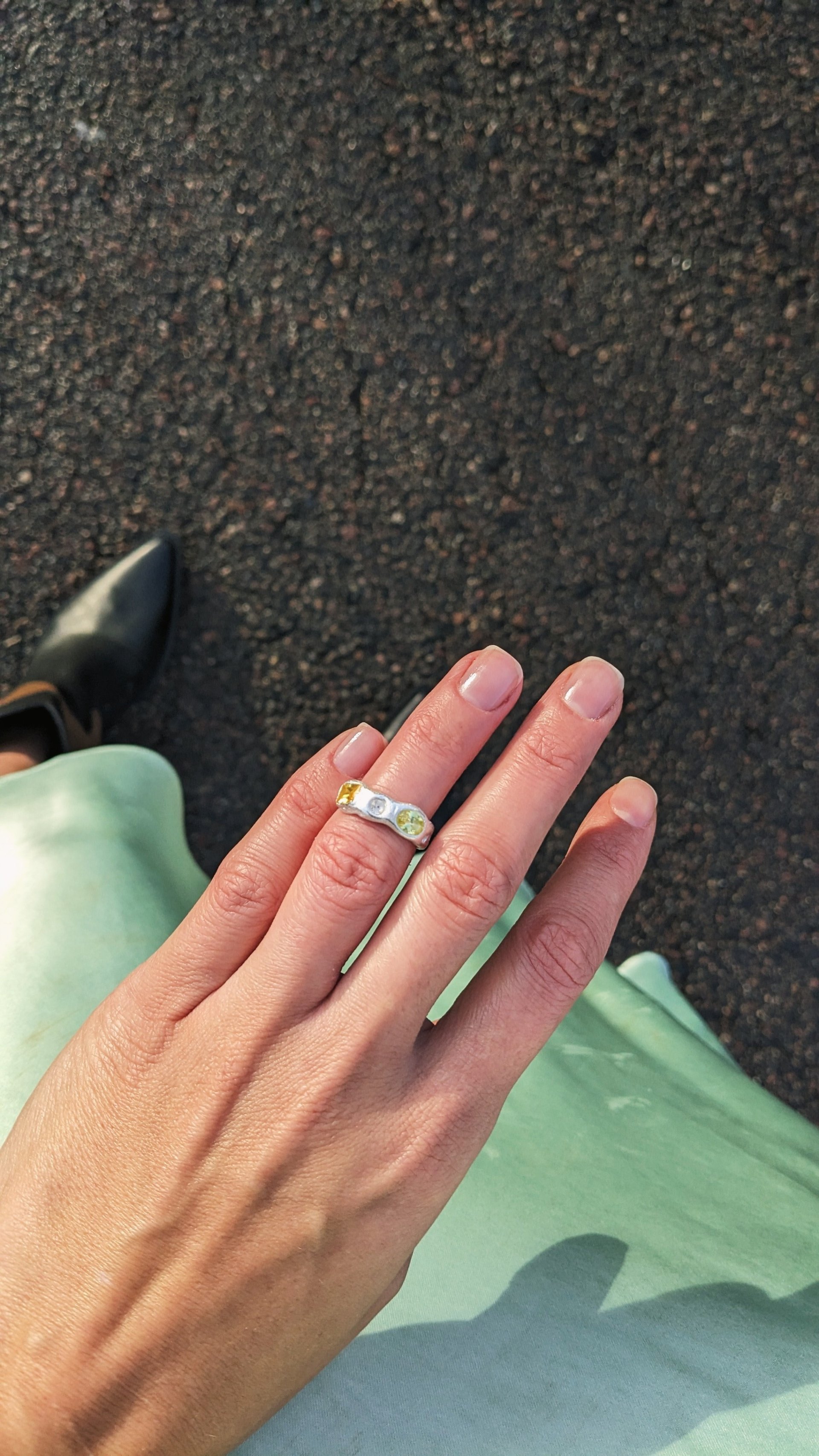 A person's hand with two rings on it
