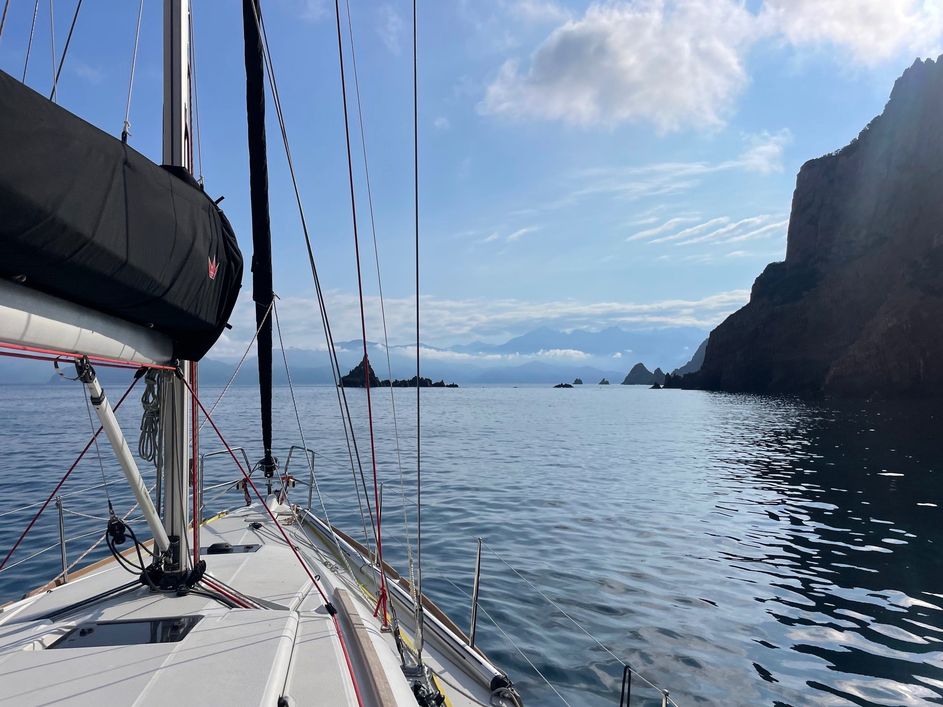 an abstract photo of a curved building with a blue sky in the background
