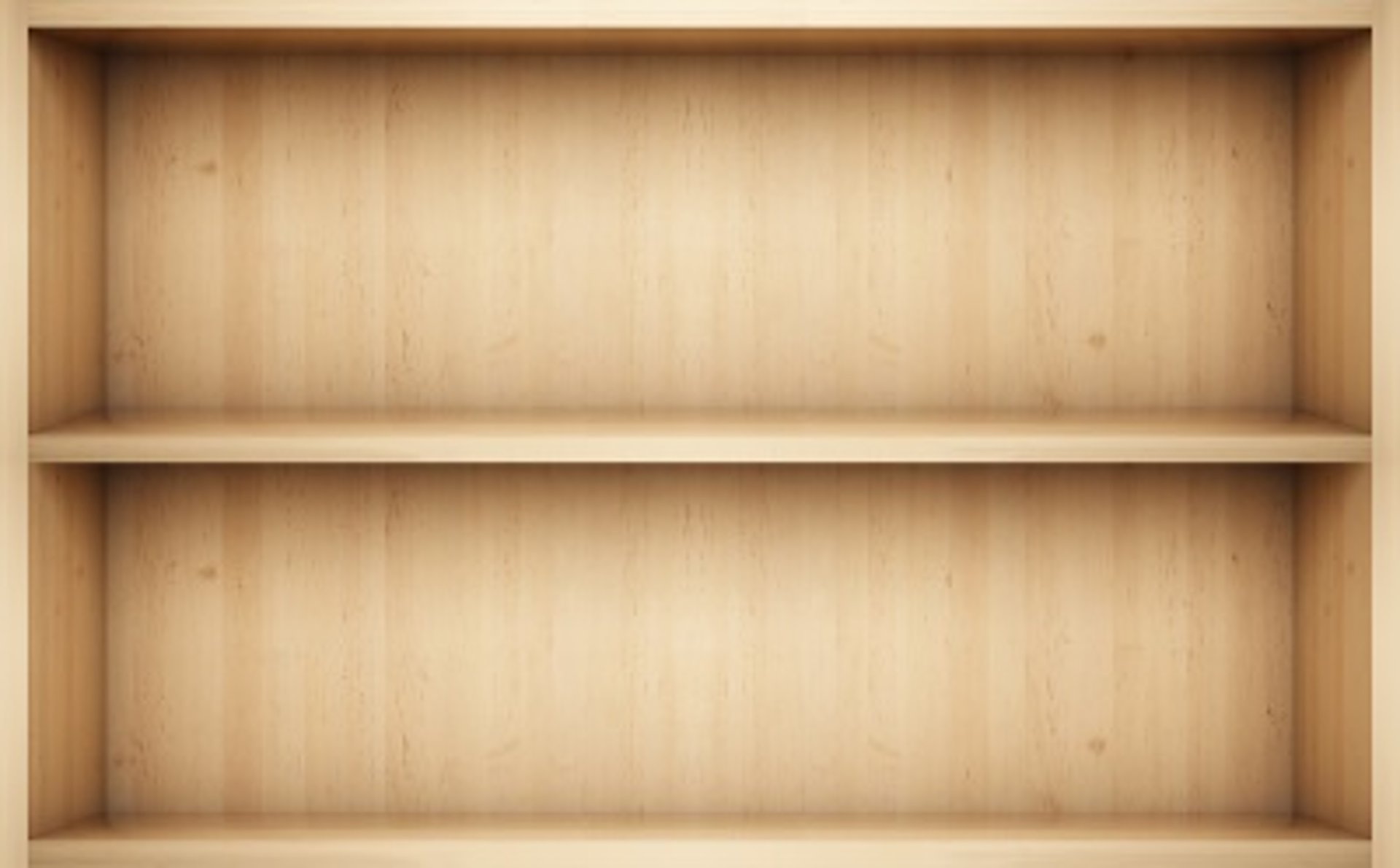 a row of books sitting on top of a wooden shelf