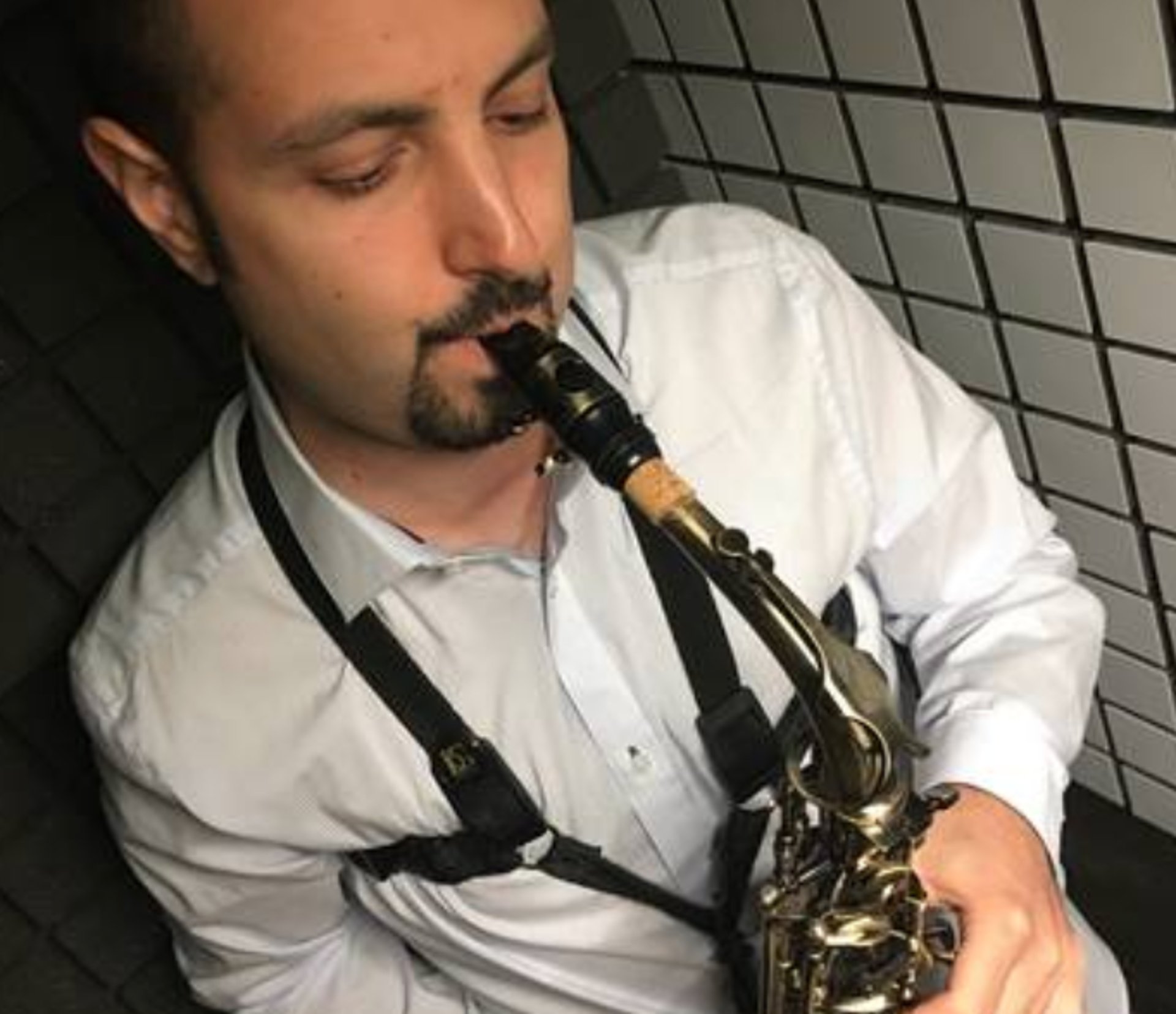 an abstract photo of a curved building with a blue sky in the background
