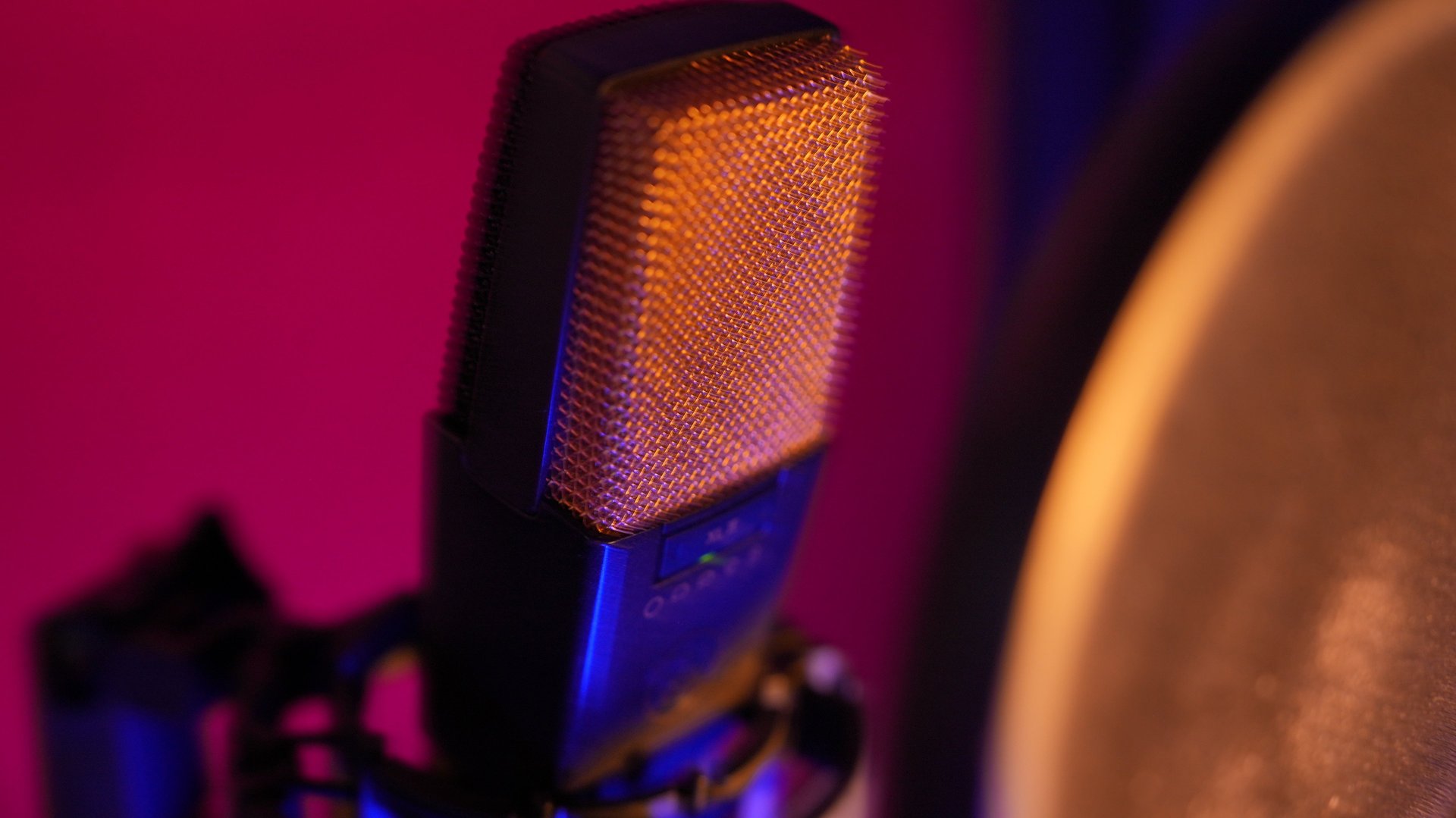 an abstract photo of a curved building with a blue sky in the background