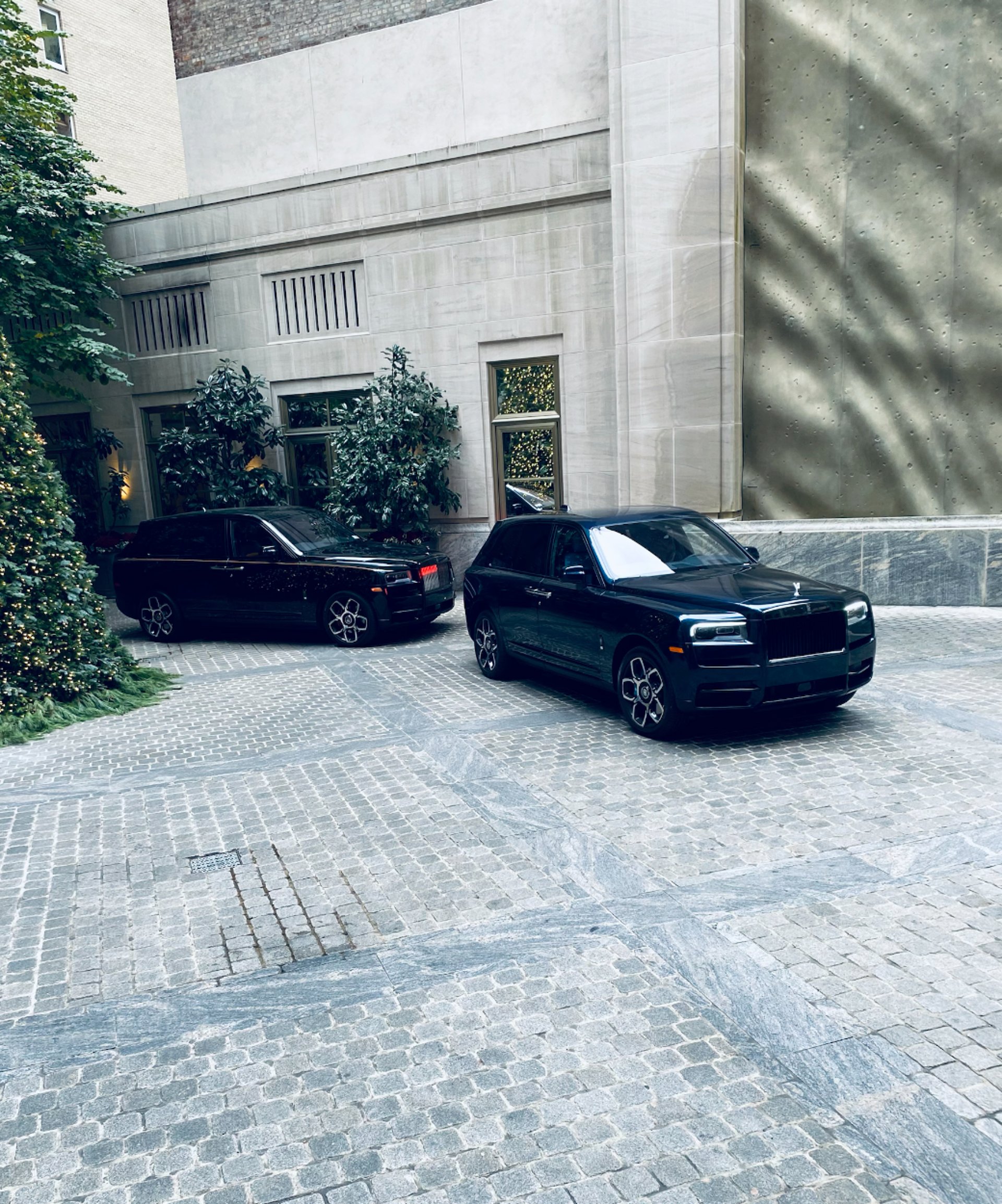 A black car parked on the side of the road
