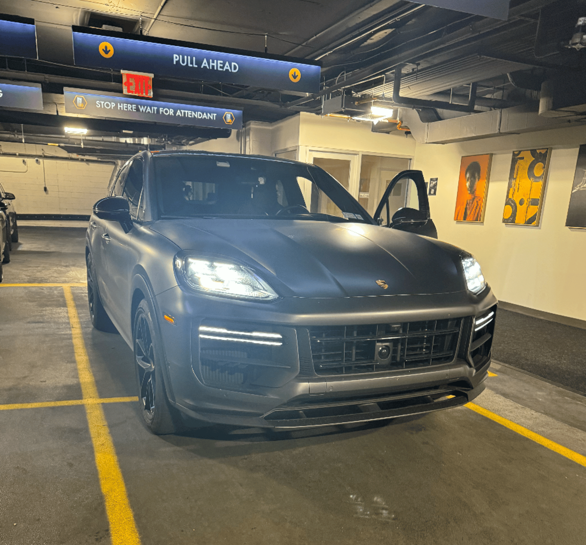 A black car parked on the side of the road