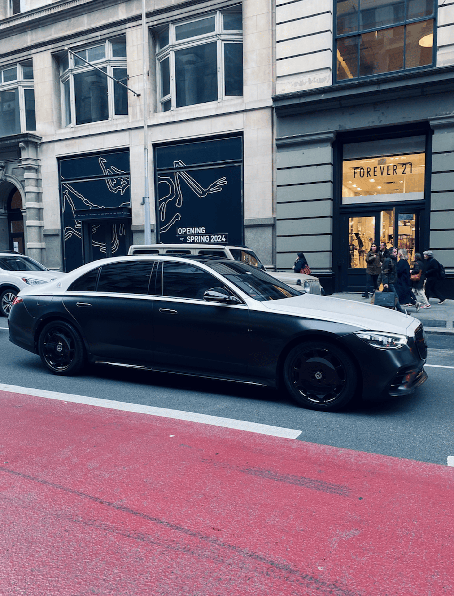 A black car parked on the side of the road