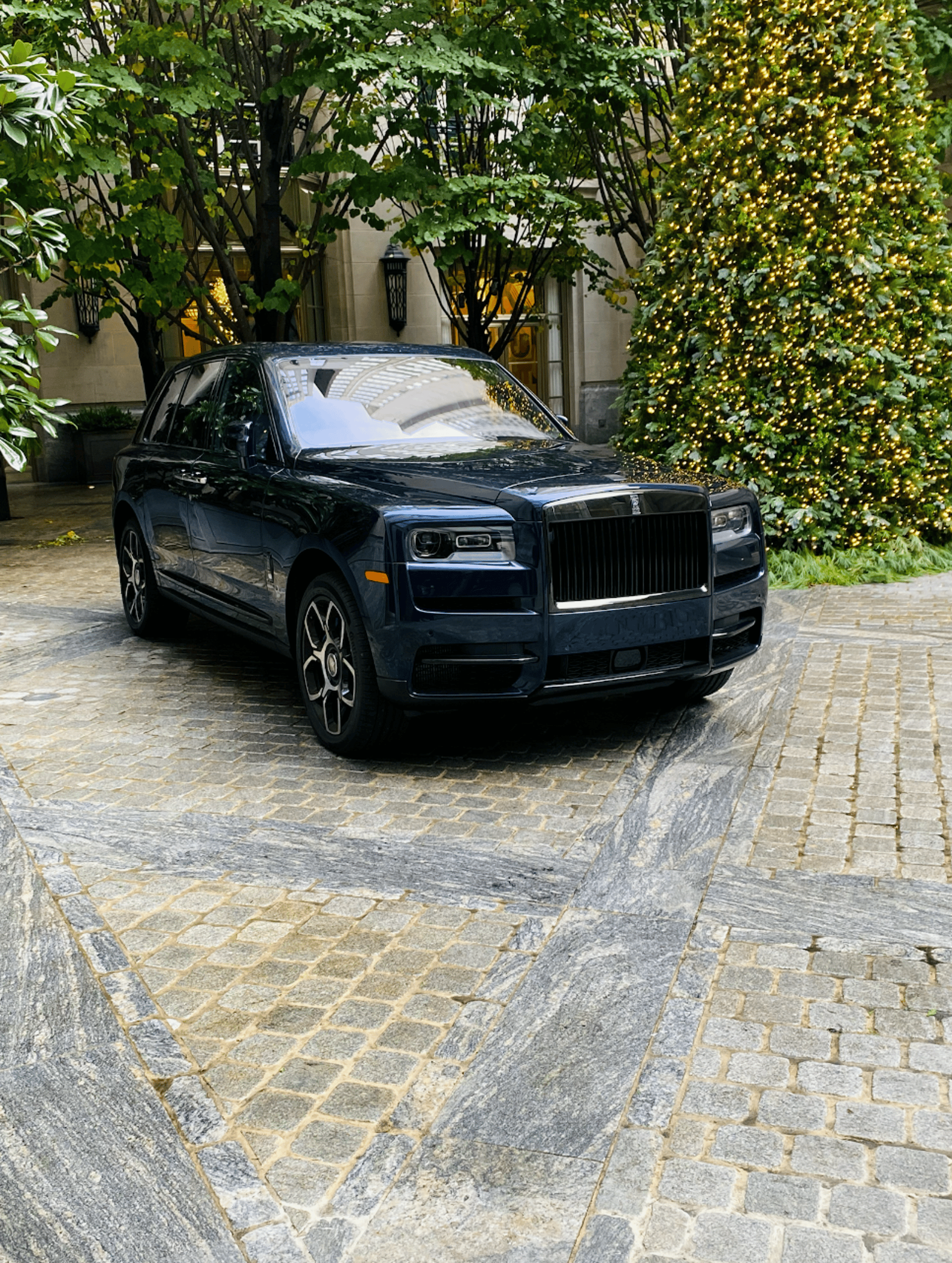 A black car parked on the side of the road