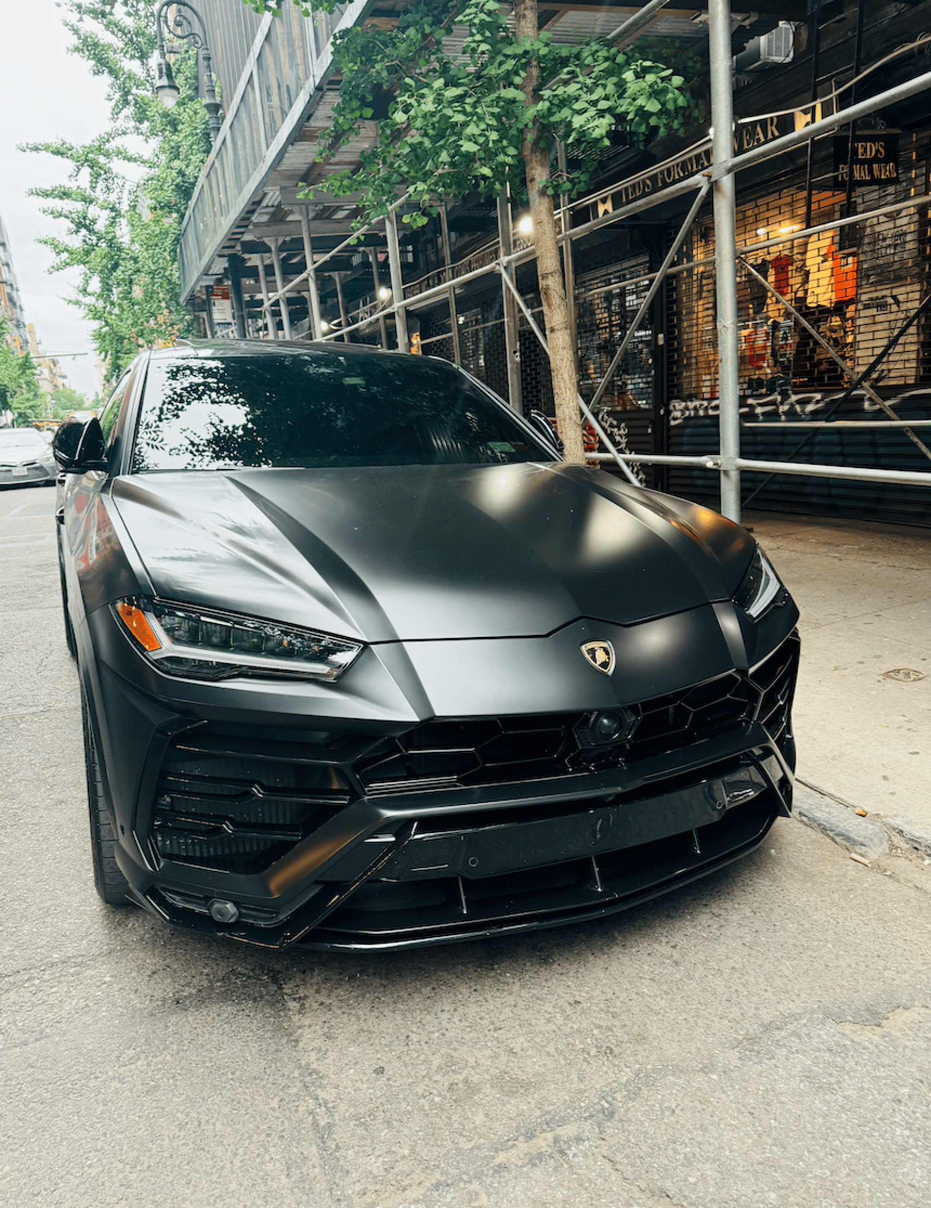 A black car parked on the side of the road