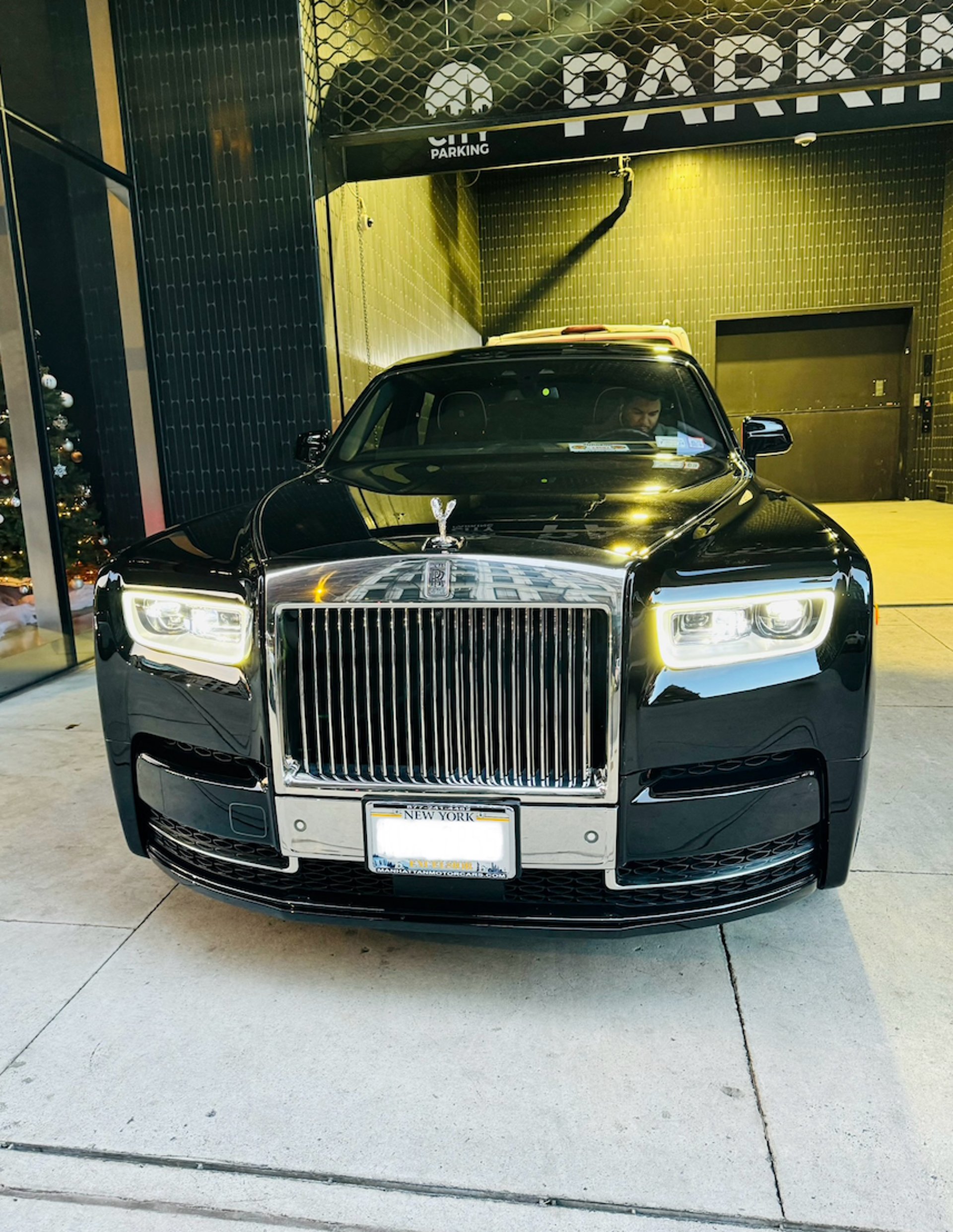 A black car parked on the side of the road