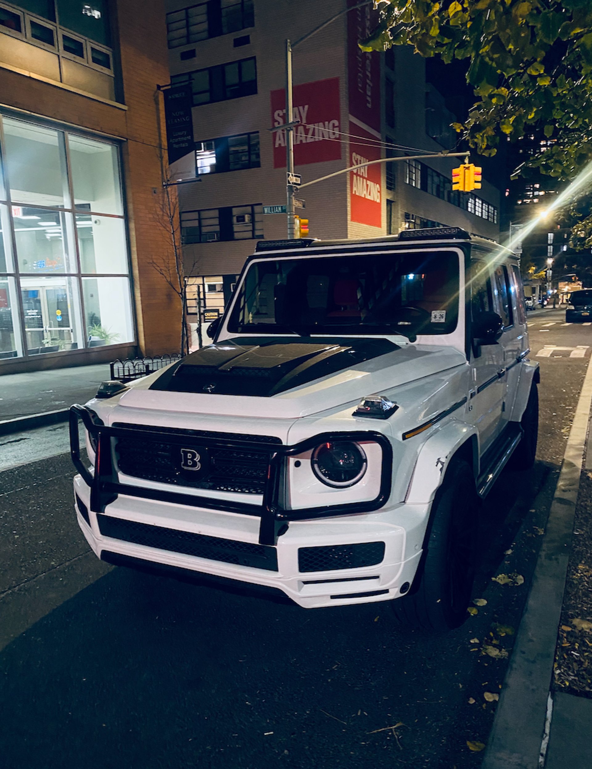 A black car parked on the side of the road