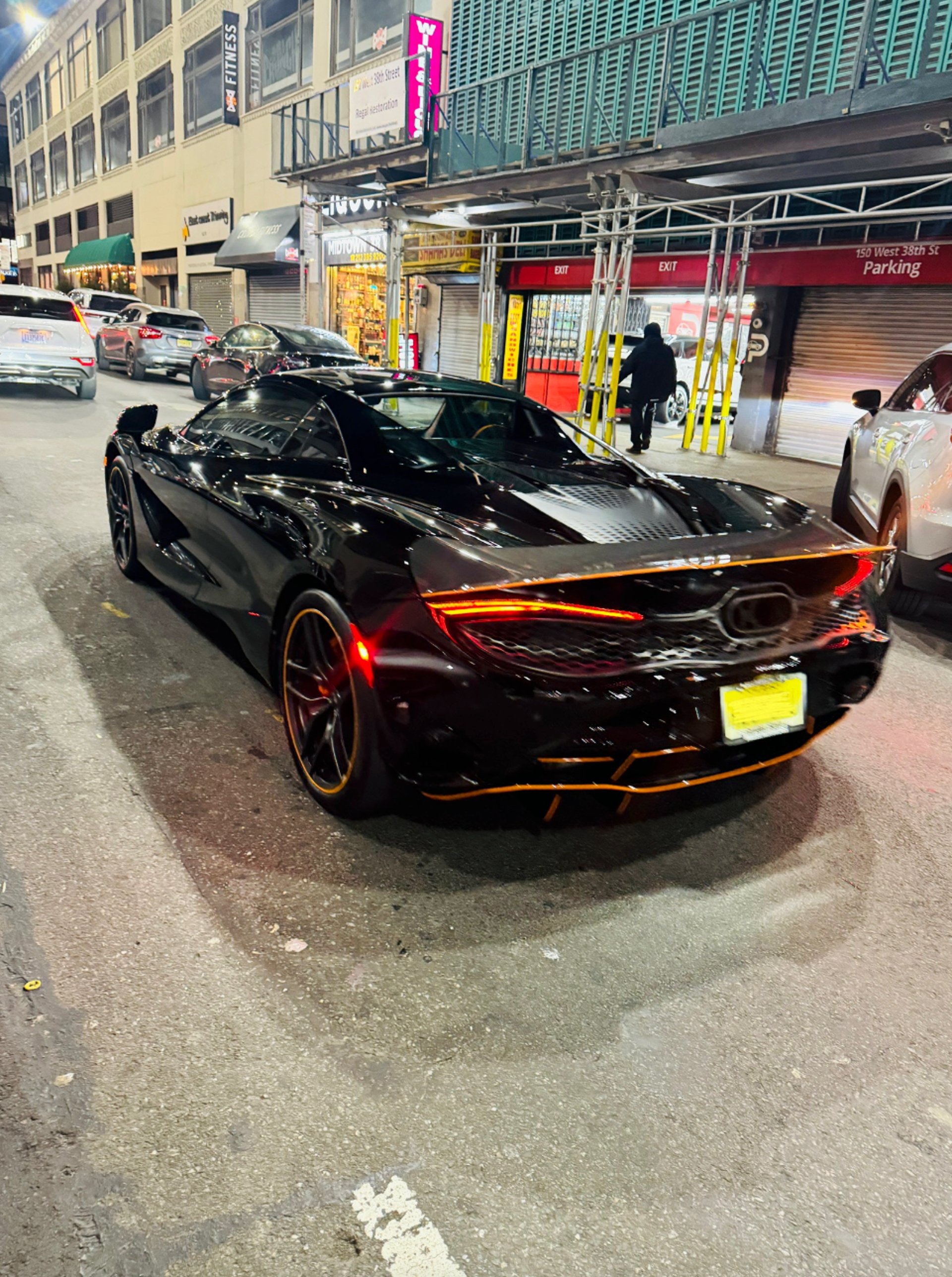 A black car parked on the side of the road