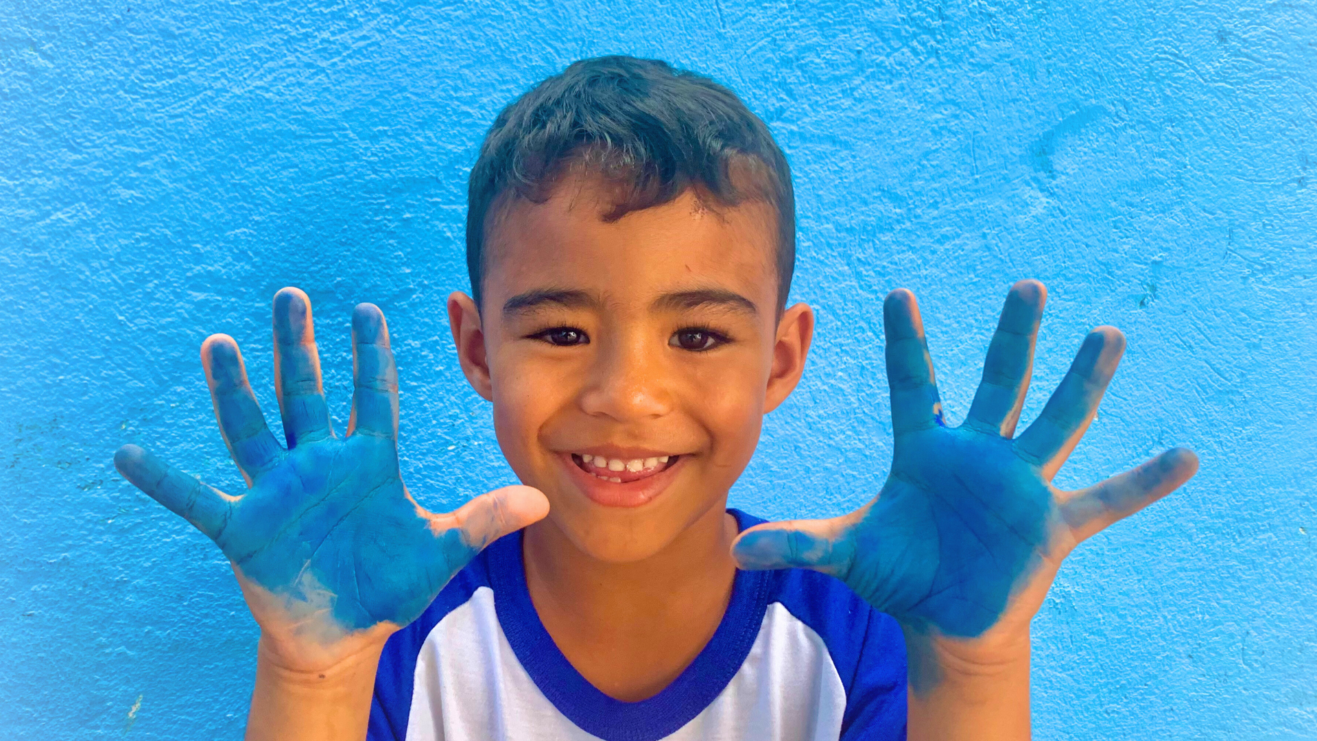 an abstract photo of a curved building with a blue sky in the background