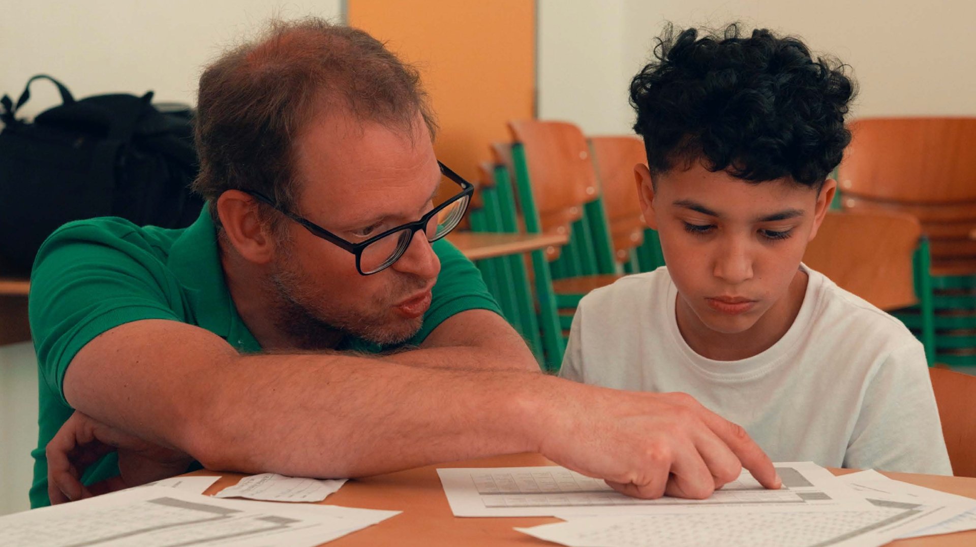 an abstract photo of a curved building with a blue sky in the background