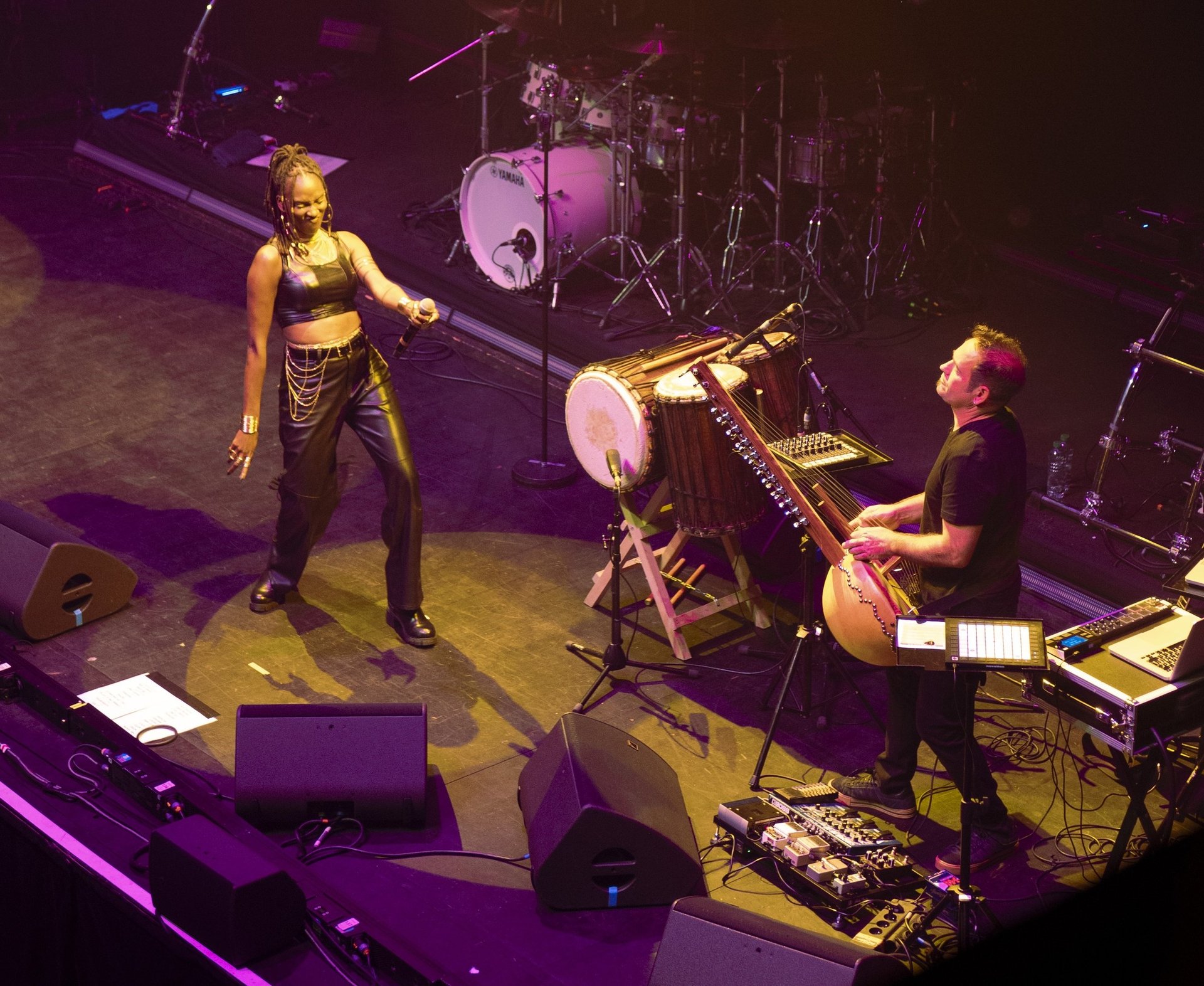an abstract photo of a curved building with a blue sky in the background